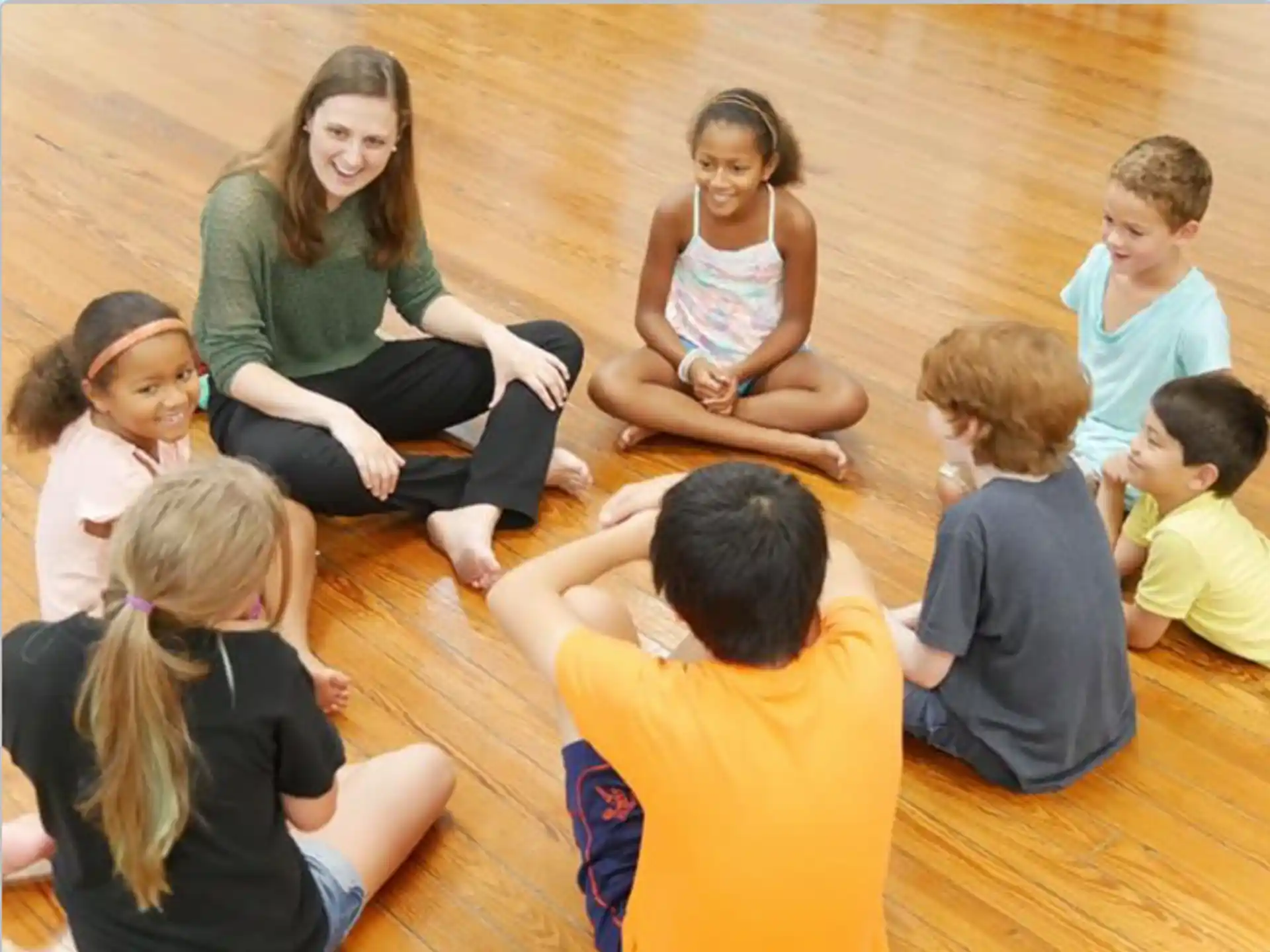 a group of children sitting on the floor