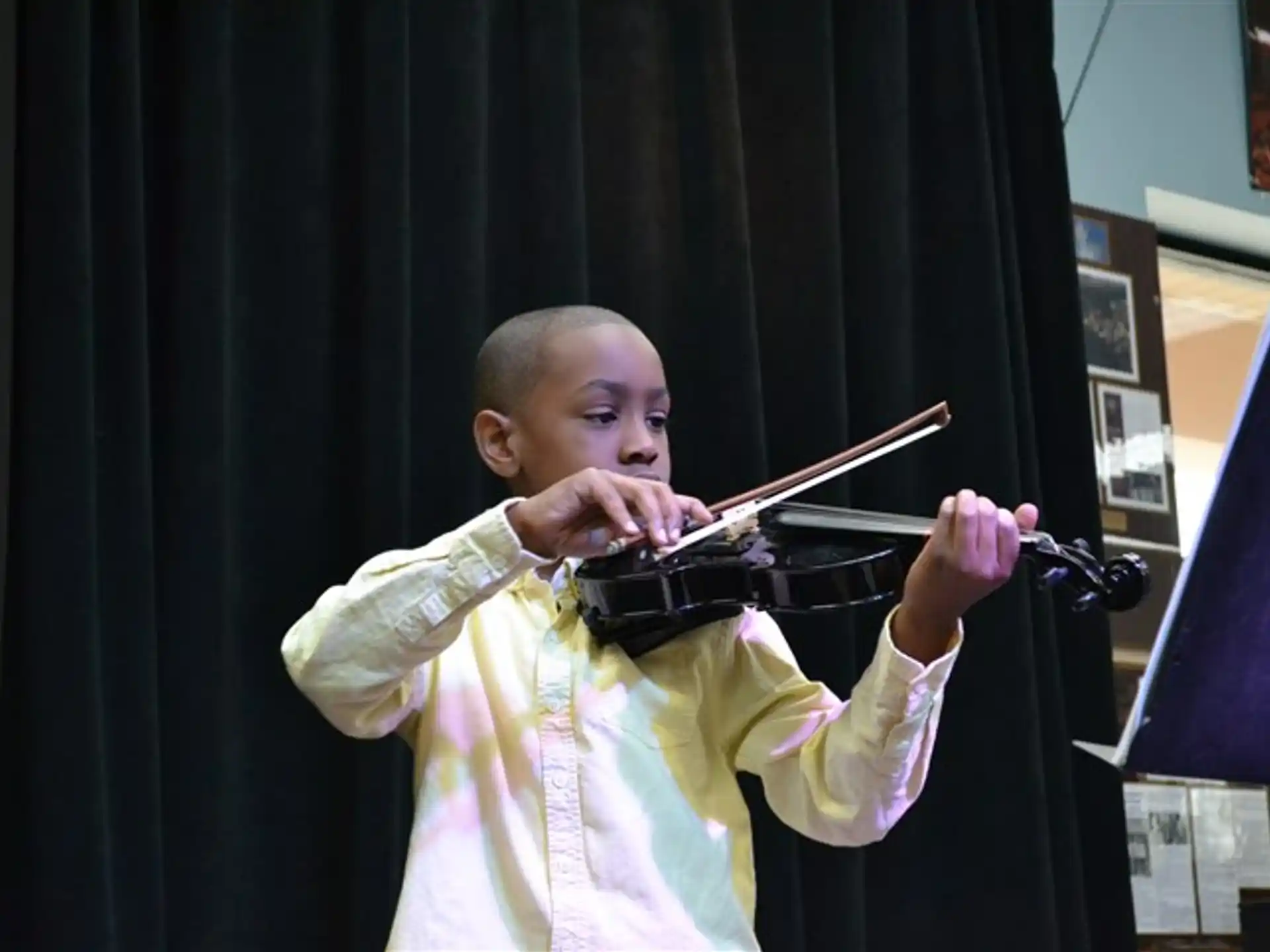 a baby playing a violin