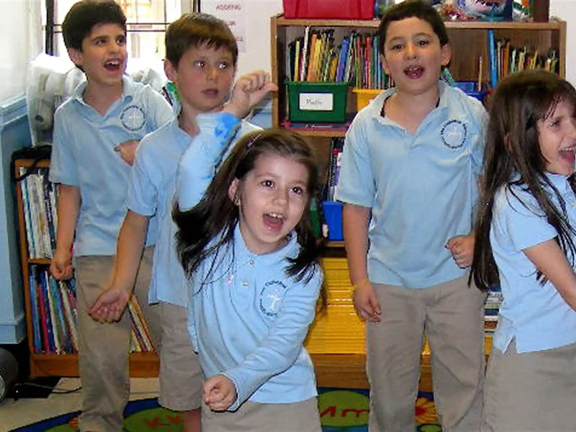 a group of children posing for a photo
