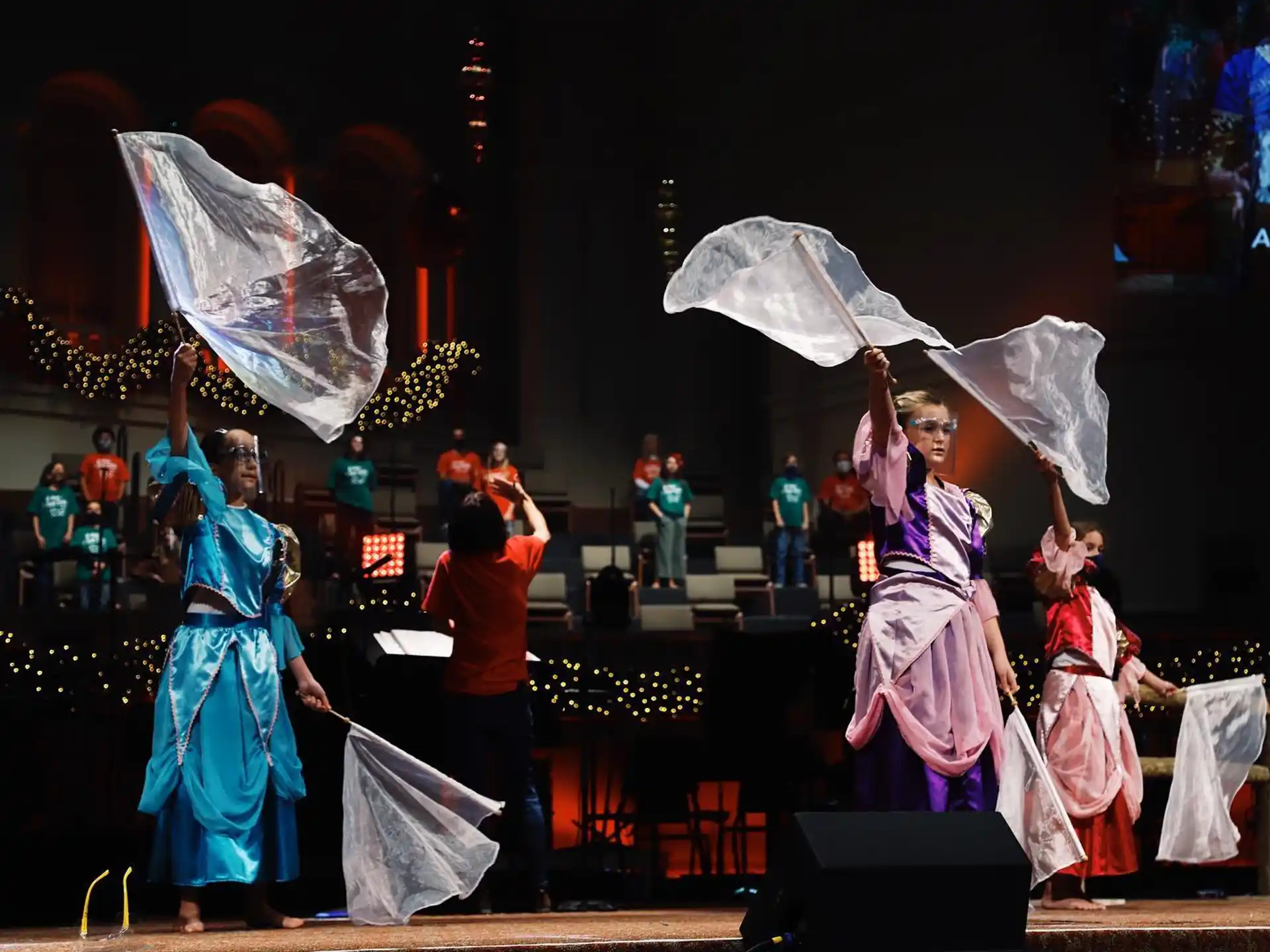 a group of people performing on stage