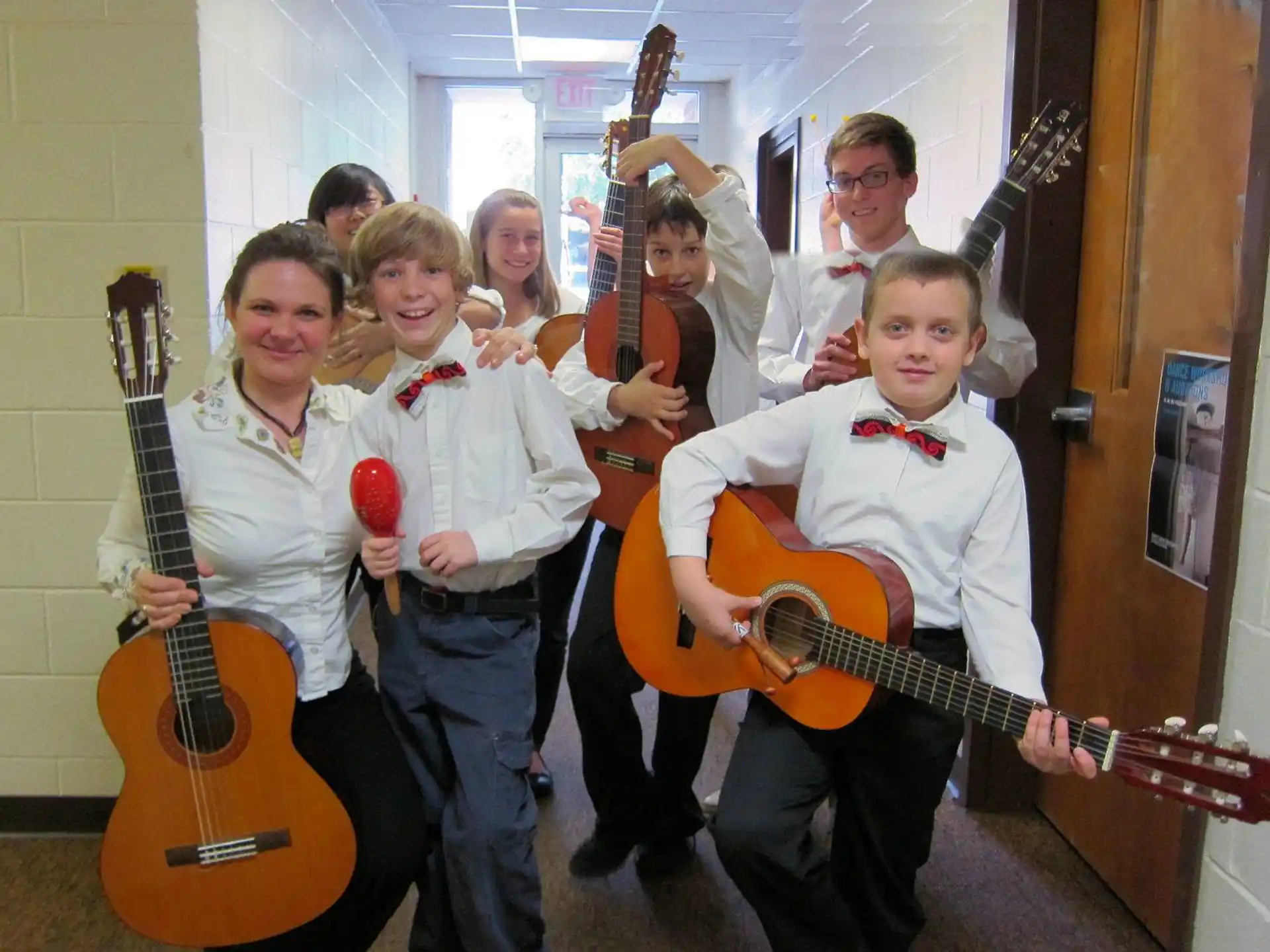 a group of kids holding musical instruments