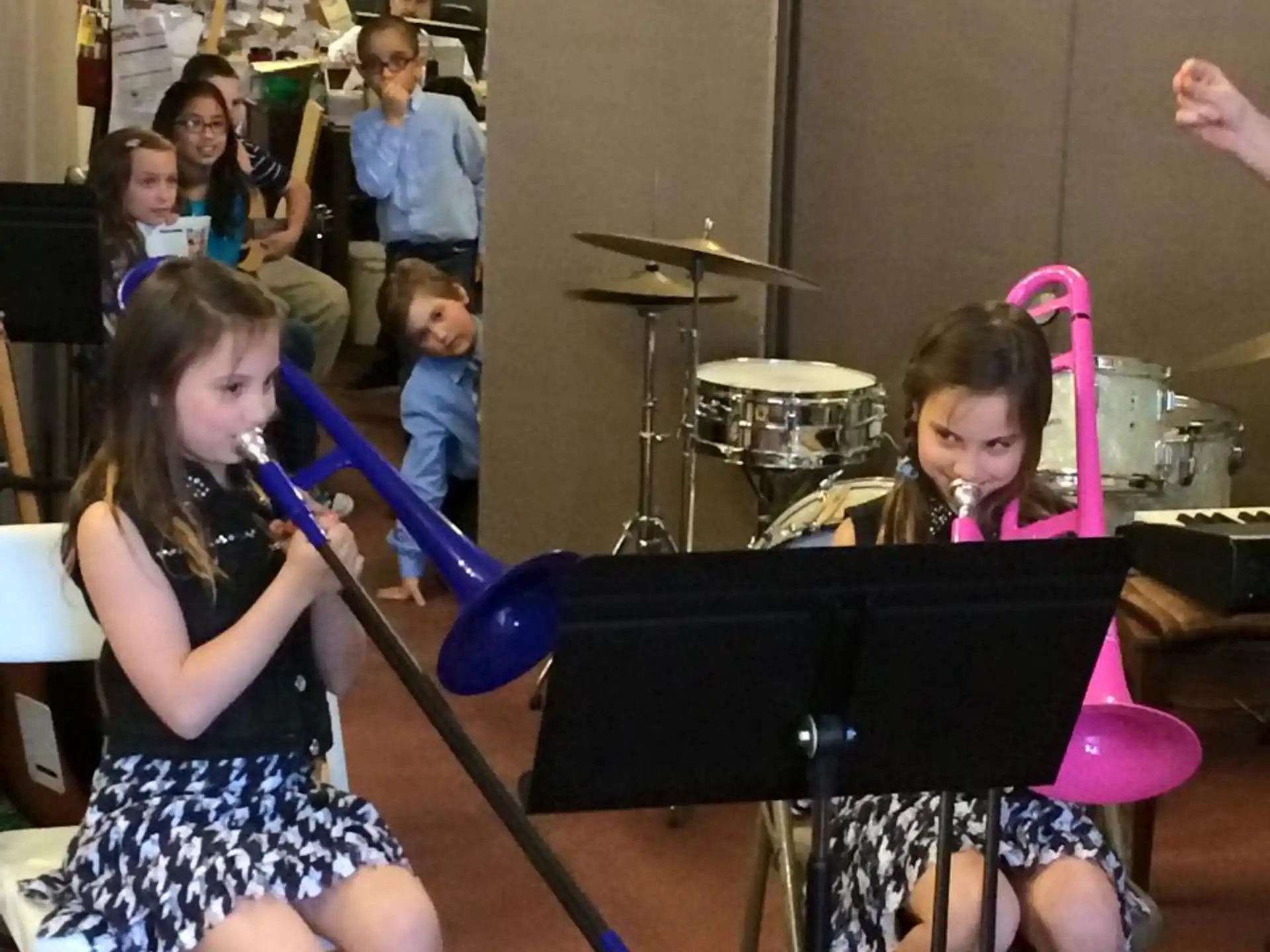 a group of girls playing musical instruments