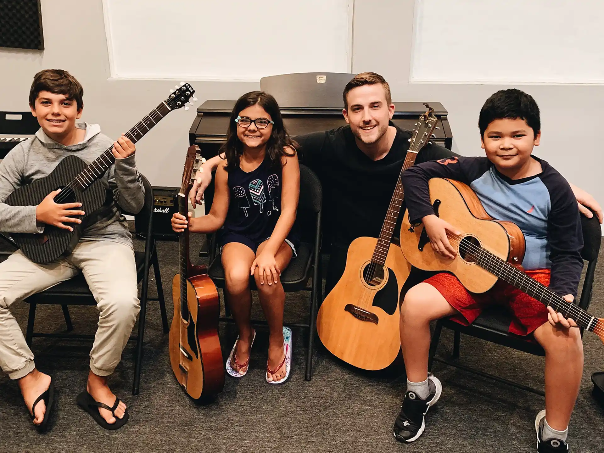 a group of people holding guitars