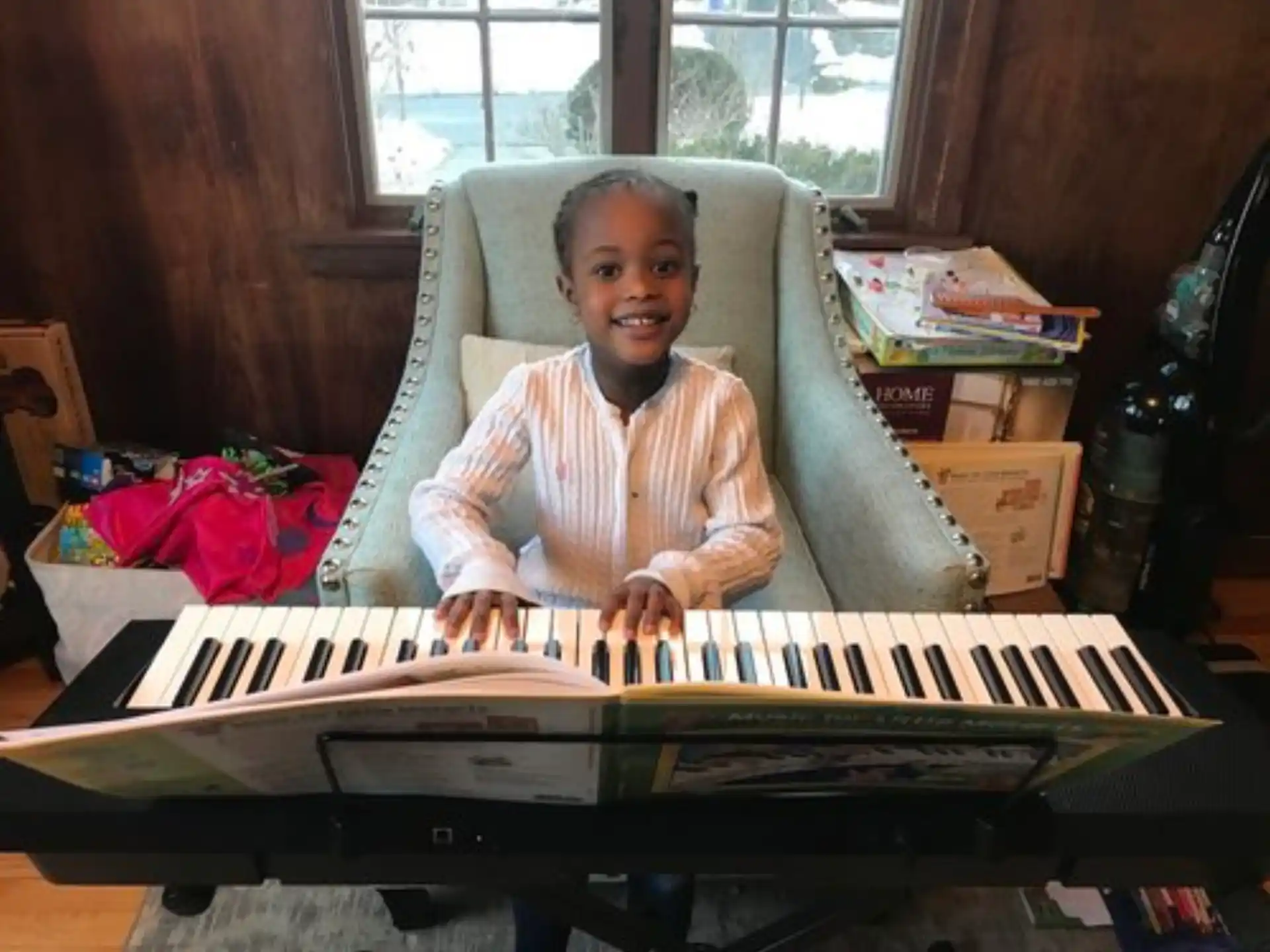 a child sitting at a piano