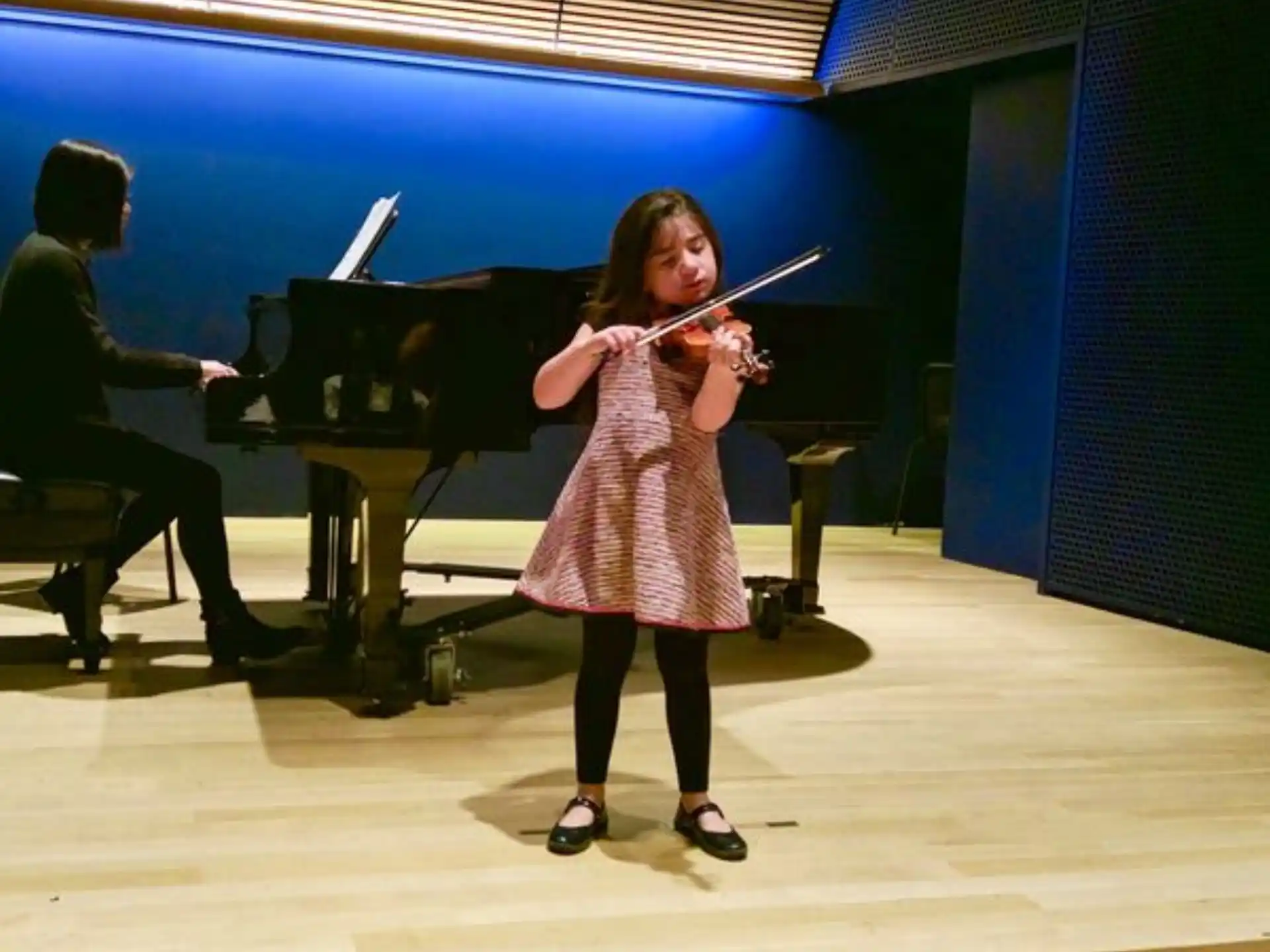 a girl playing a violin