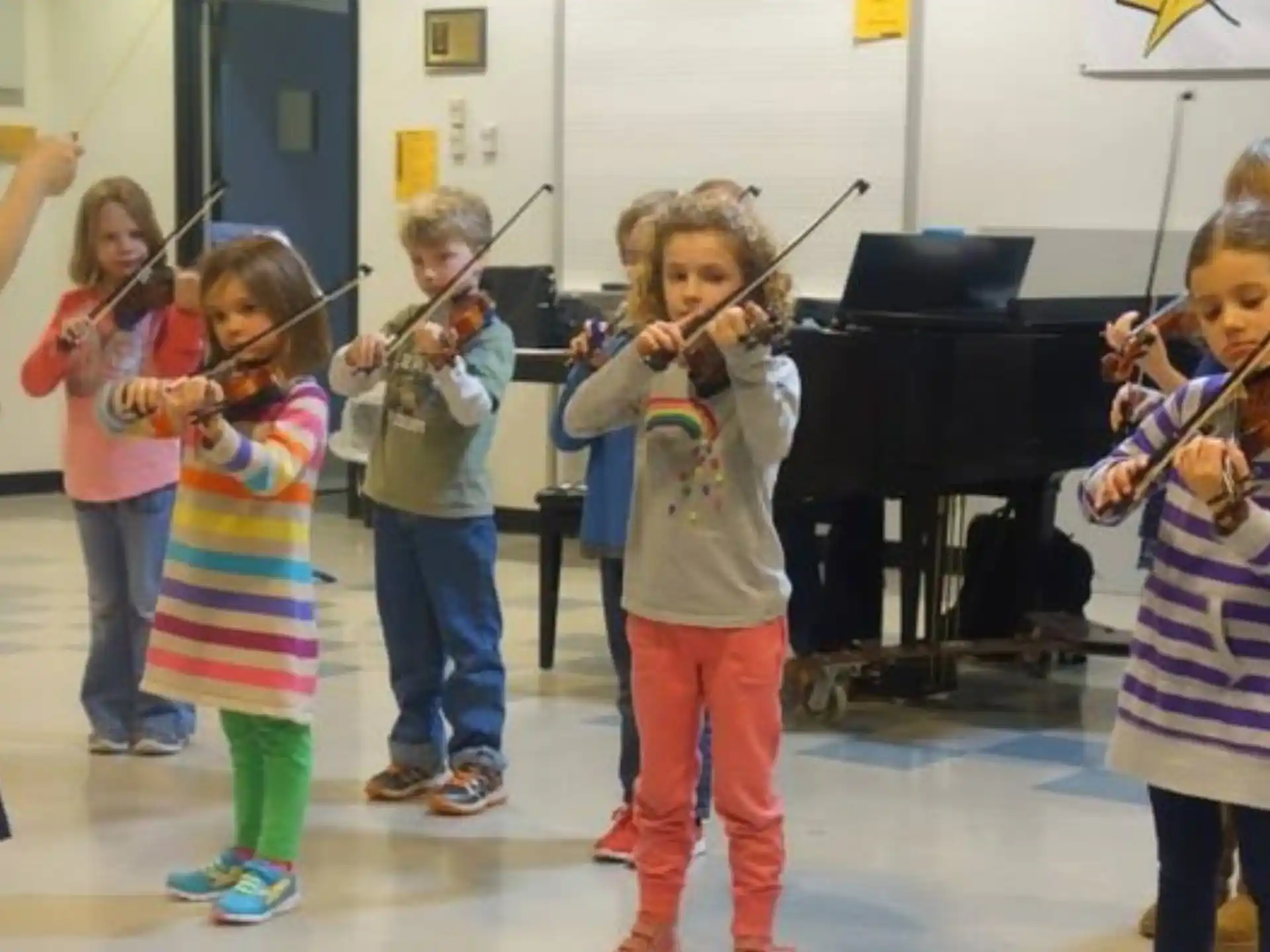 a group of children playing instruments