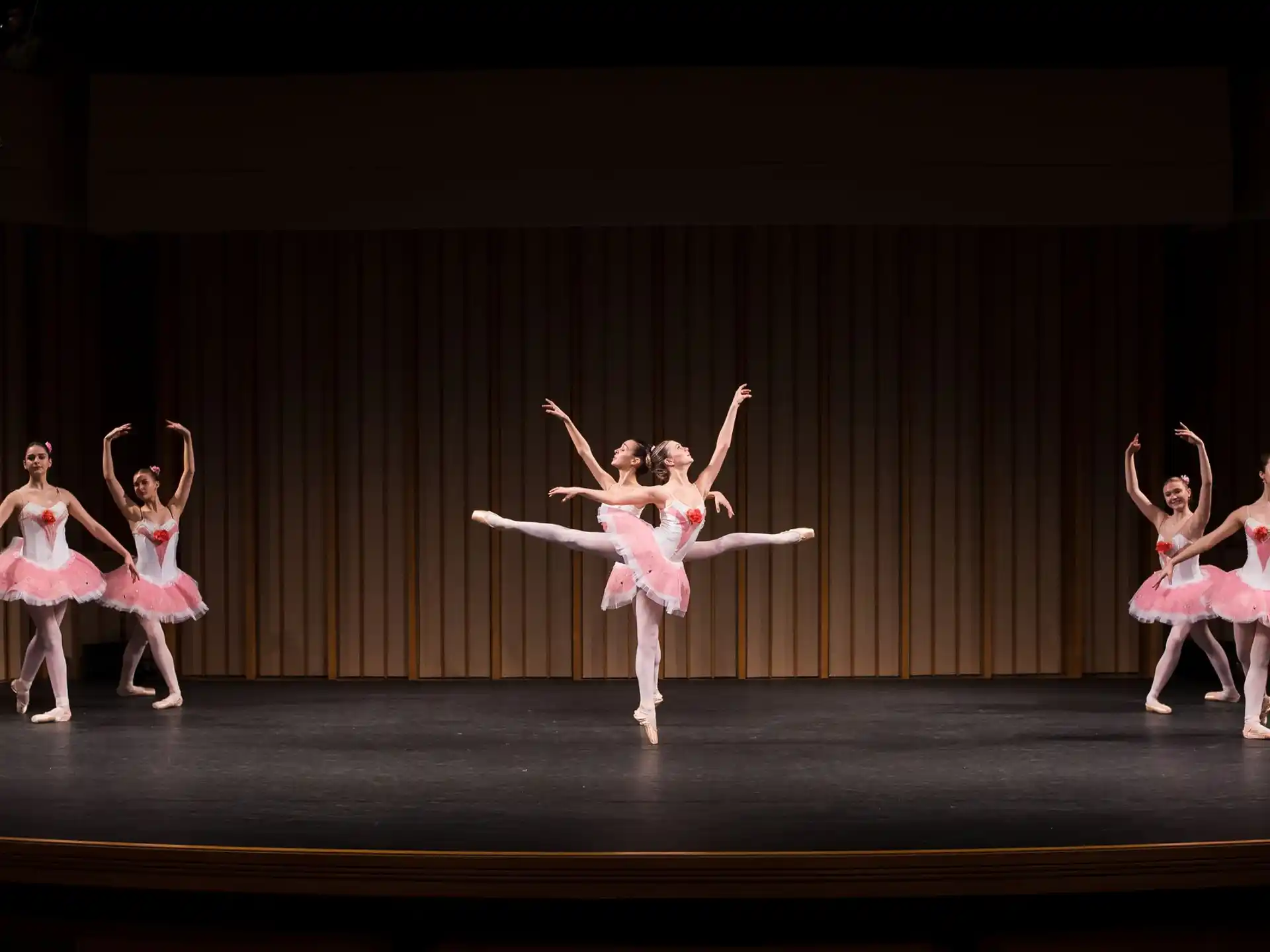 a group of women dancing on a stage