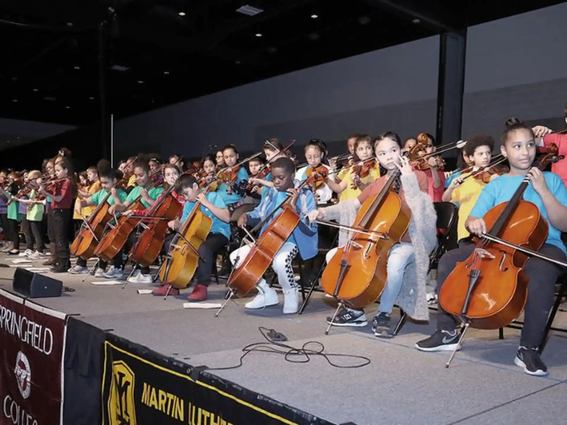 a group of people holding musical instruments