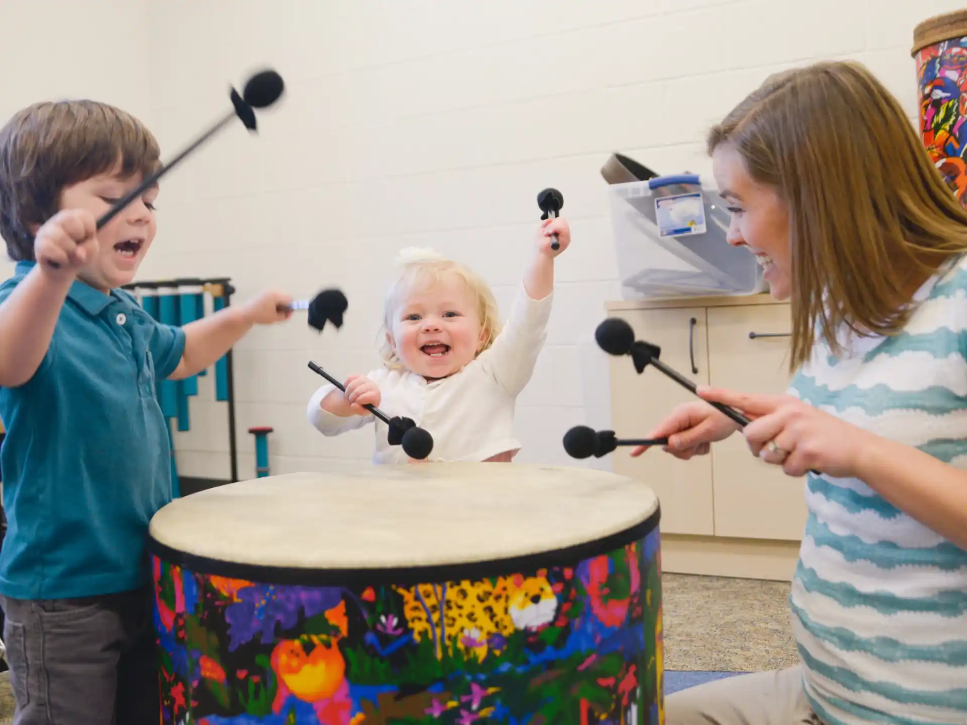 a group of kids painting