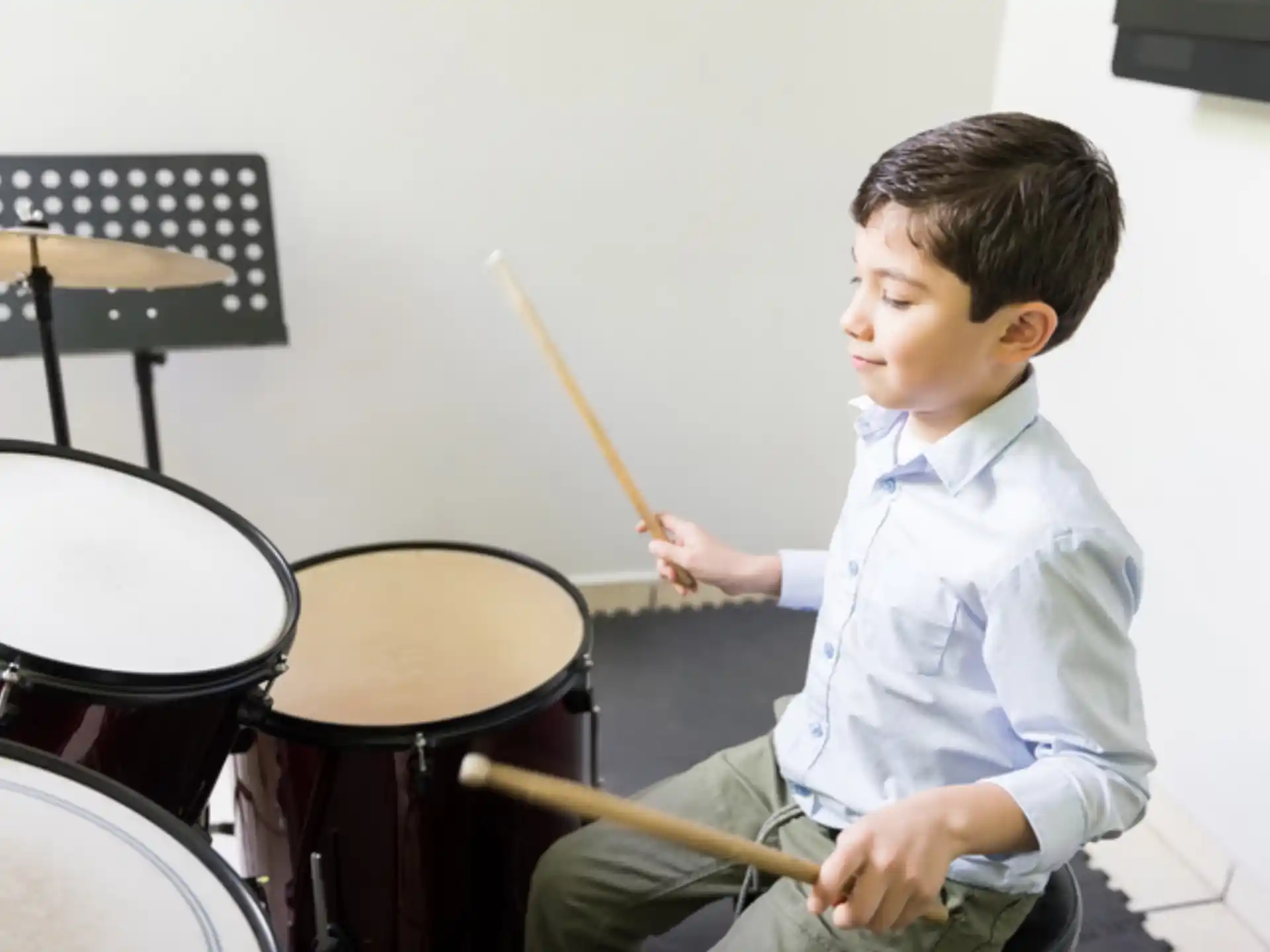 a boy playing drums