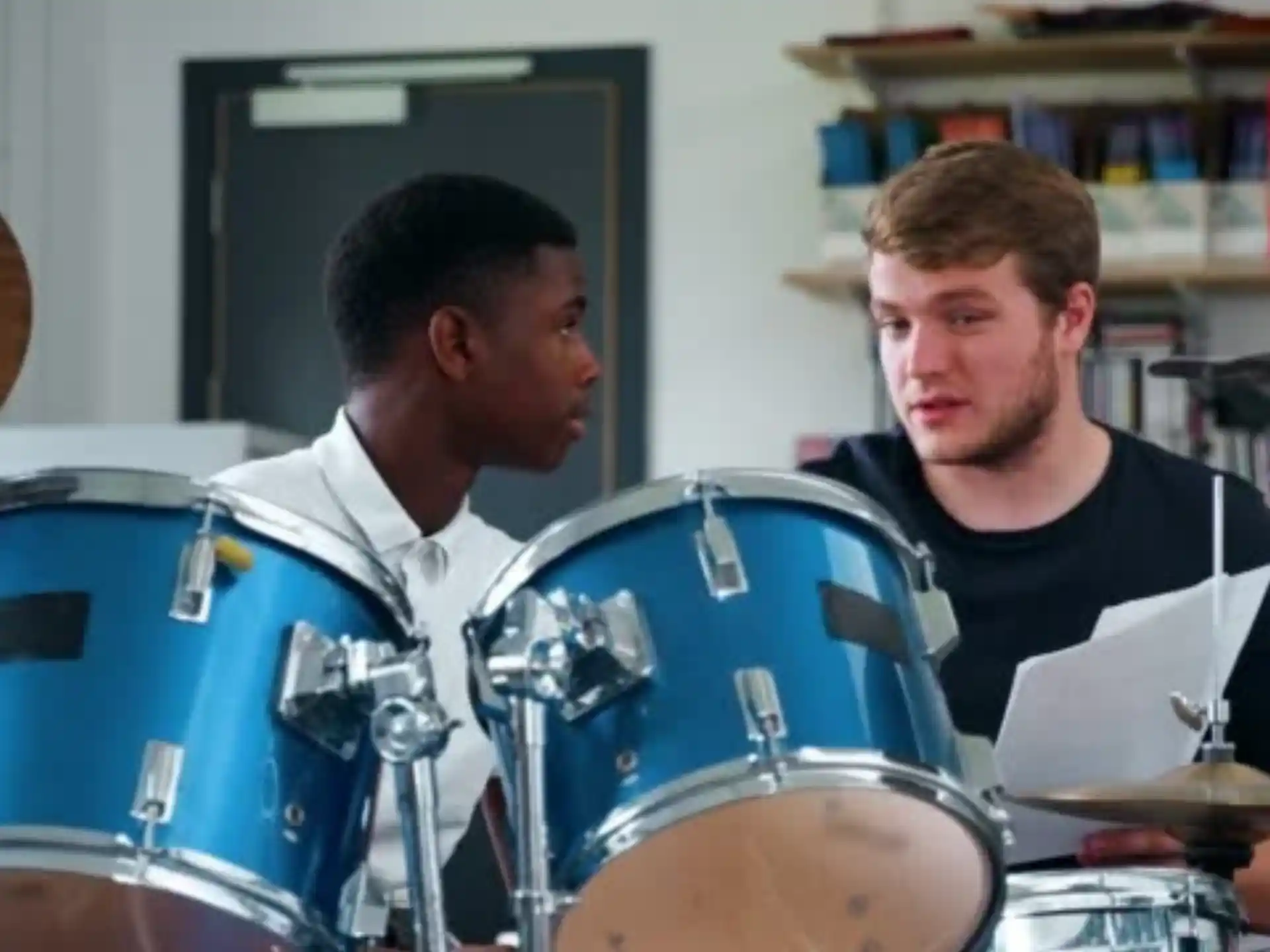 a couple of men playing drums