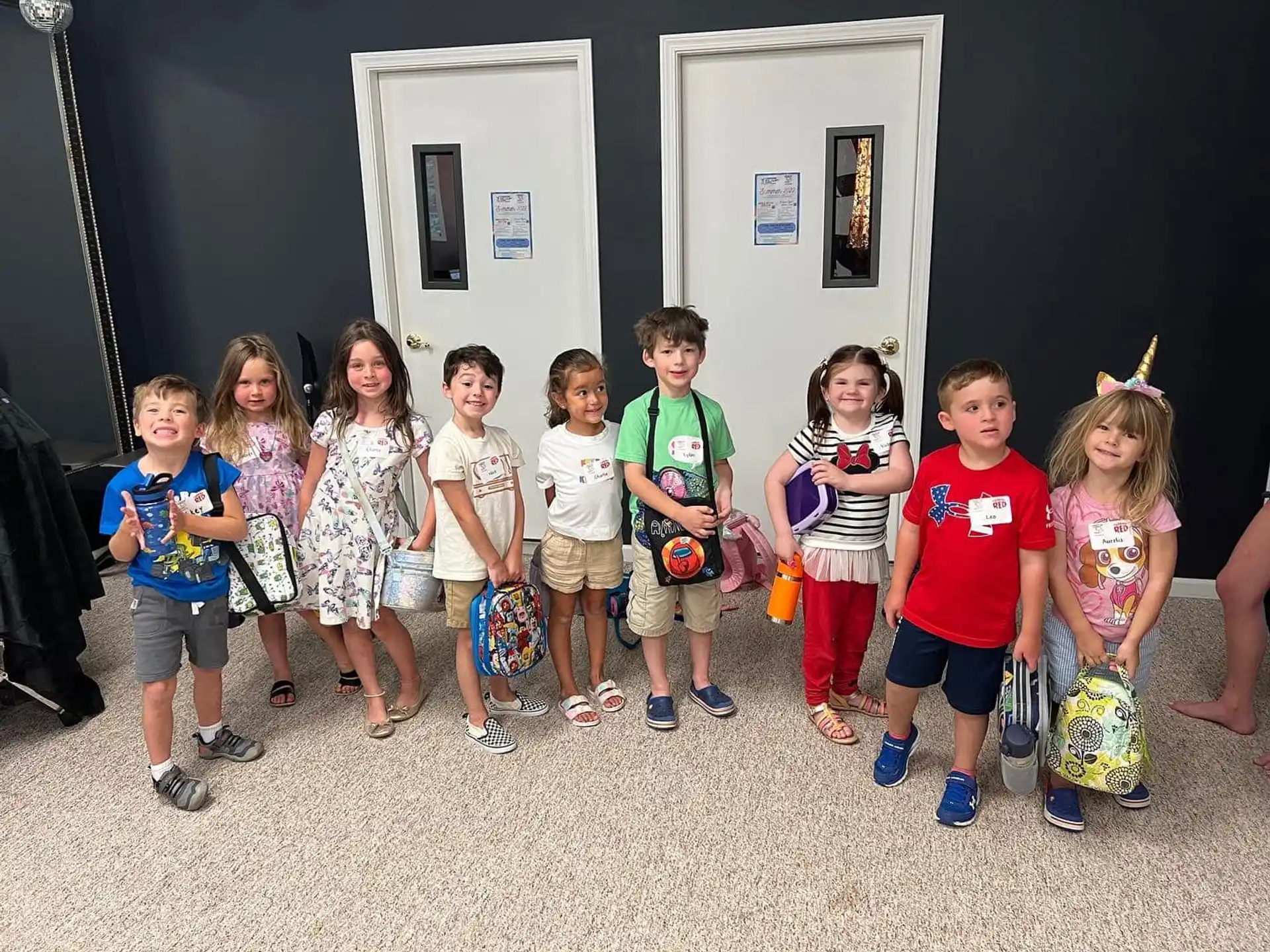 a group of children posing for a photo