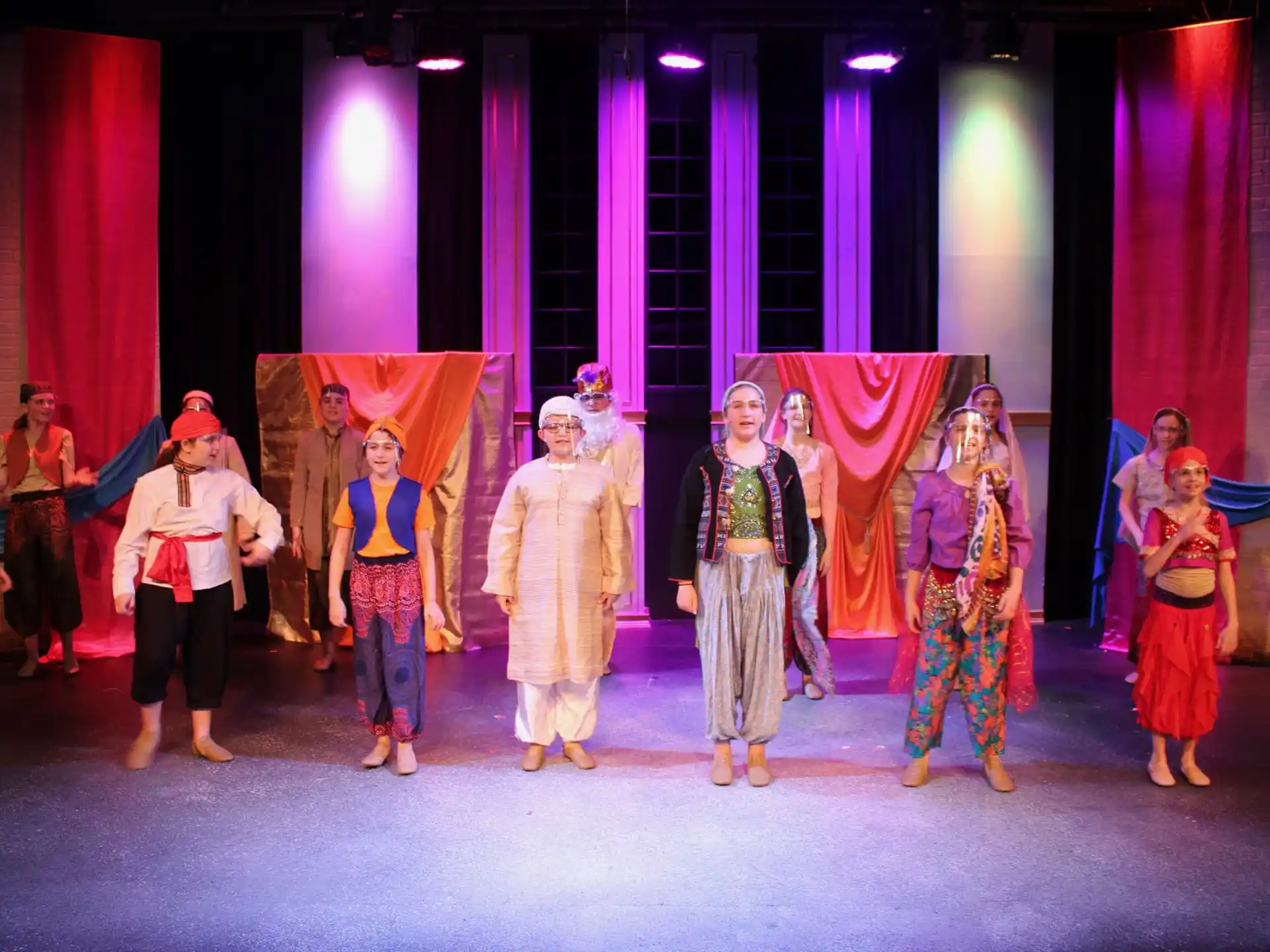 a group of people dancing on a stage