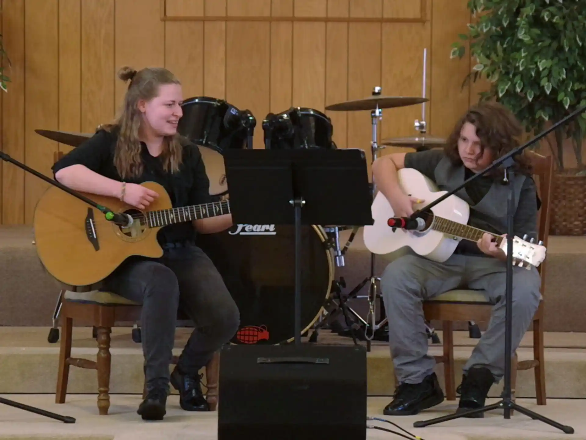 a couple of men playing guitars