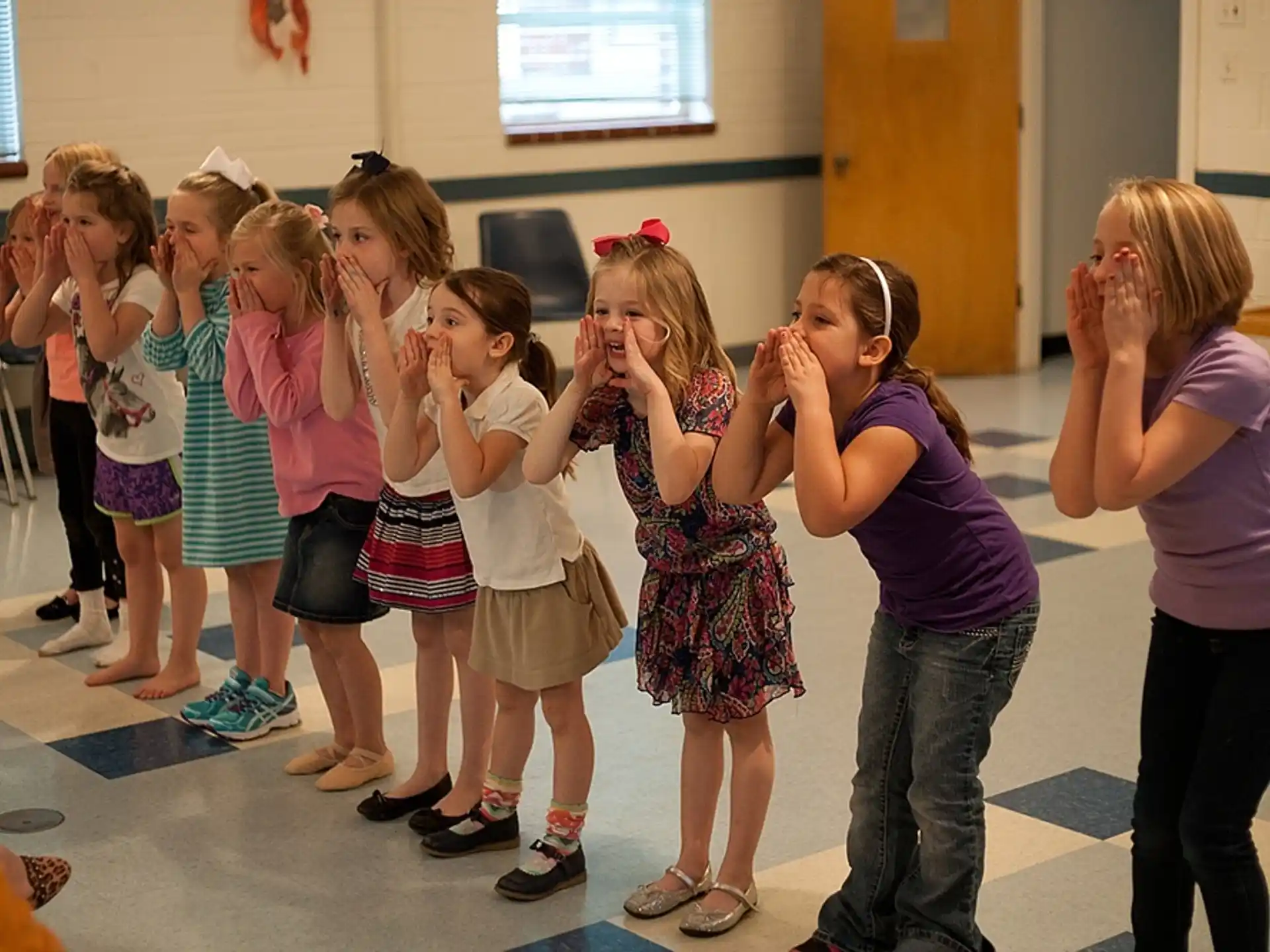 a group of girls in a classroom