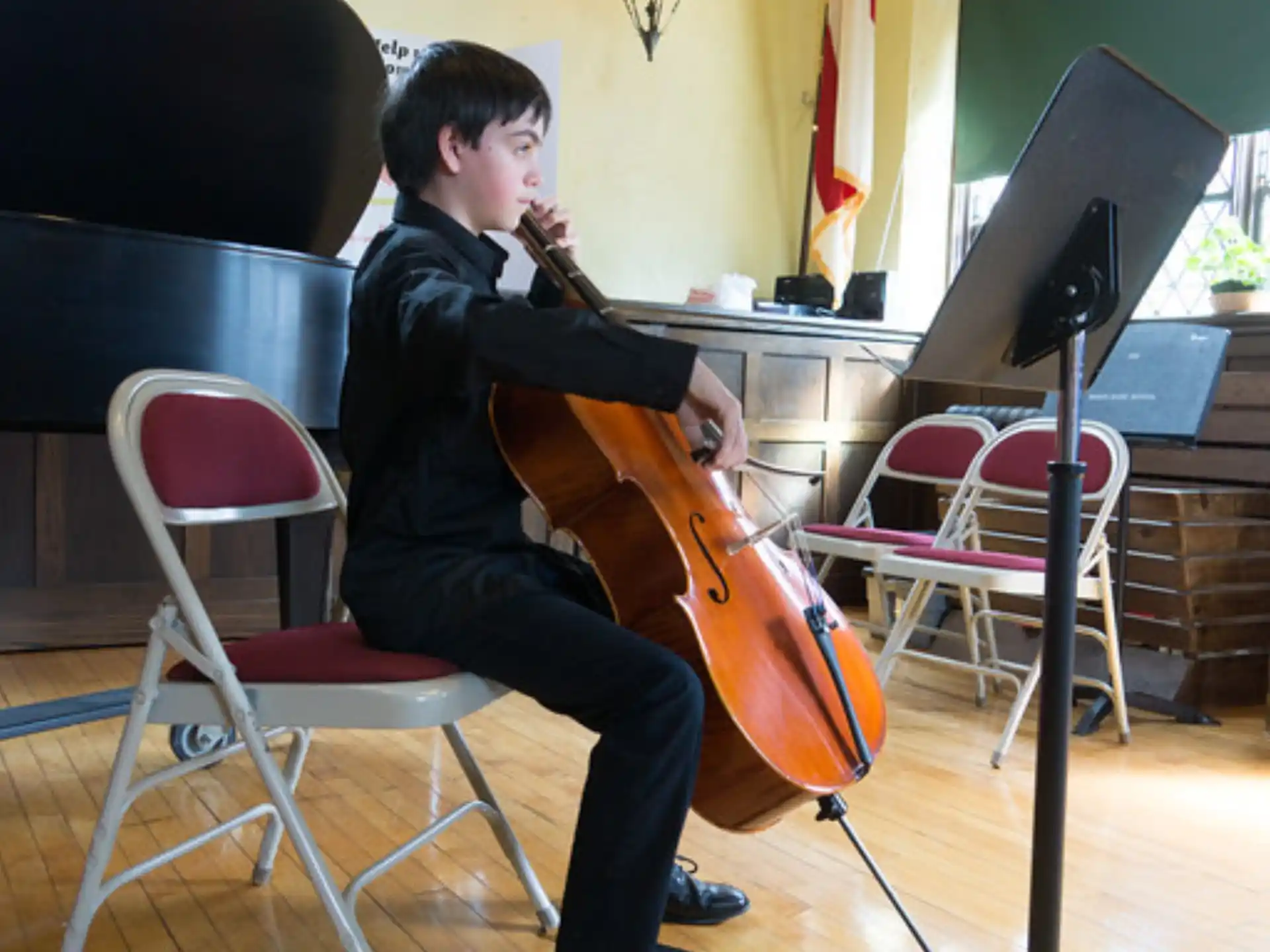 a boy playing a cello