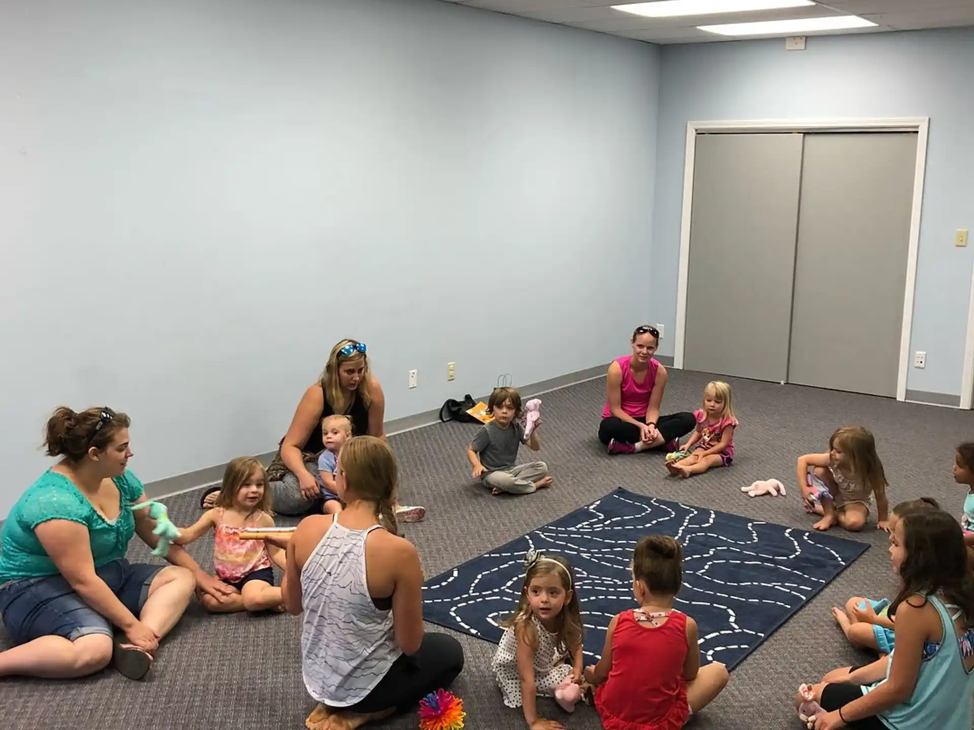 a group of people sitting on the floor
