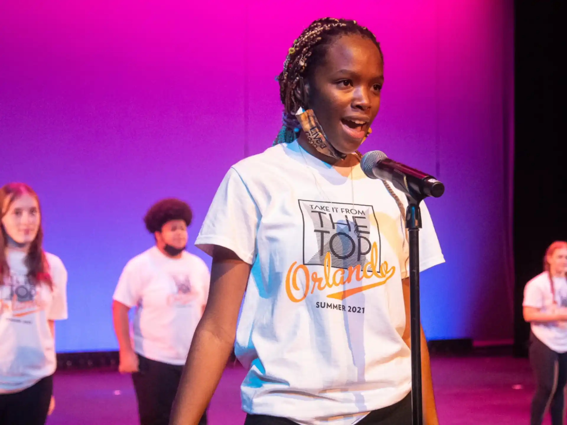 a person singing into a microphone