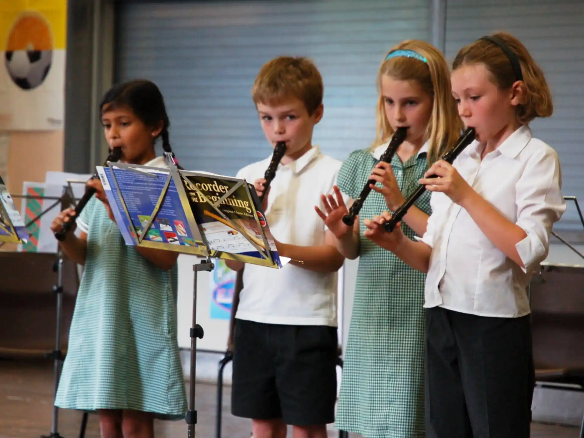 a group of children holding musical instruments