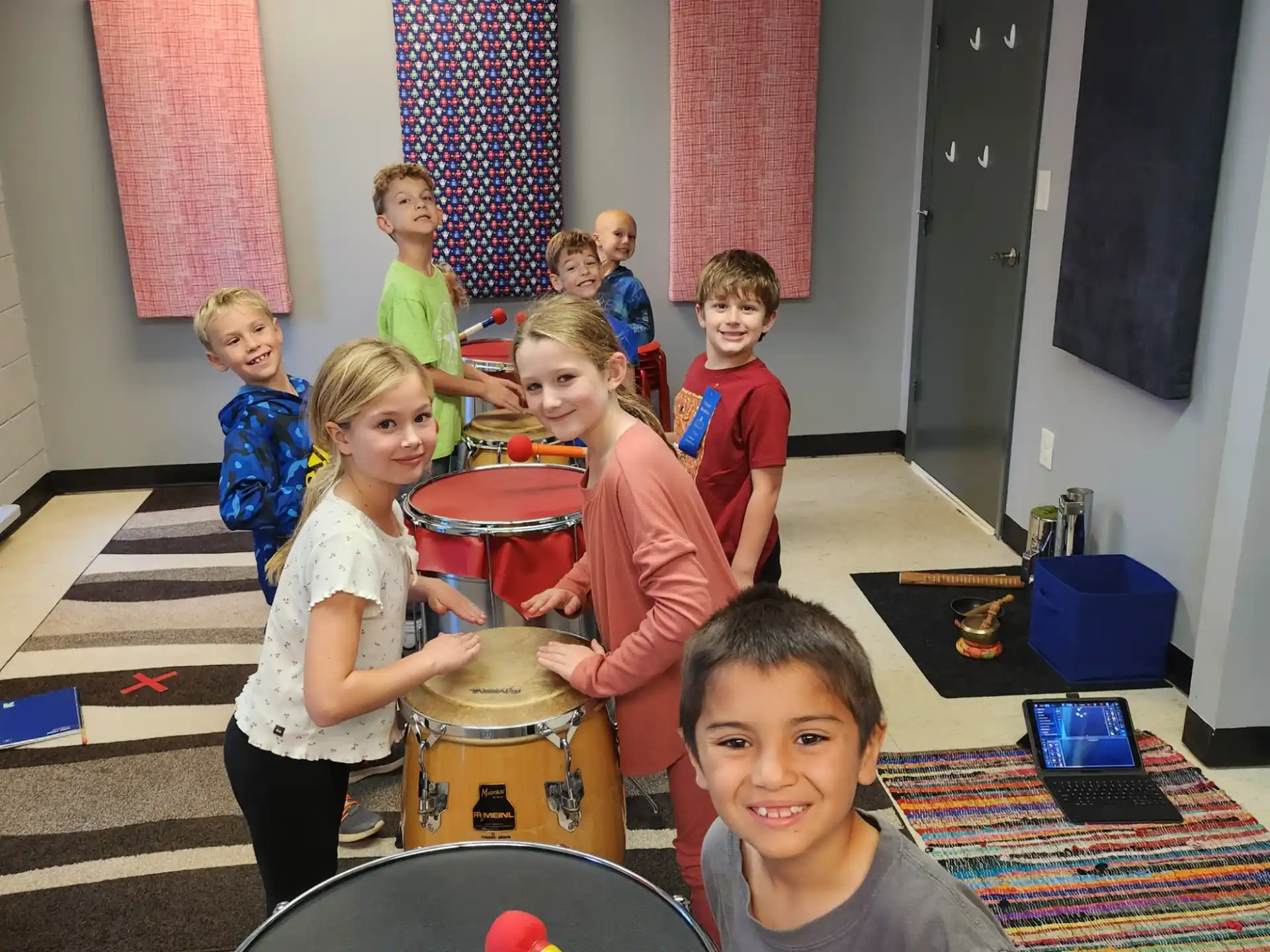 a group of kids playing drums
