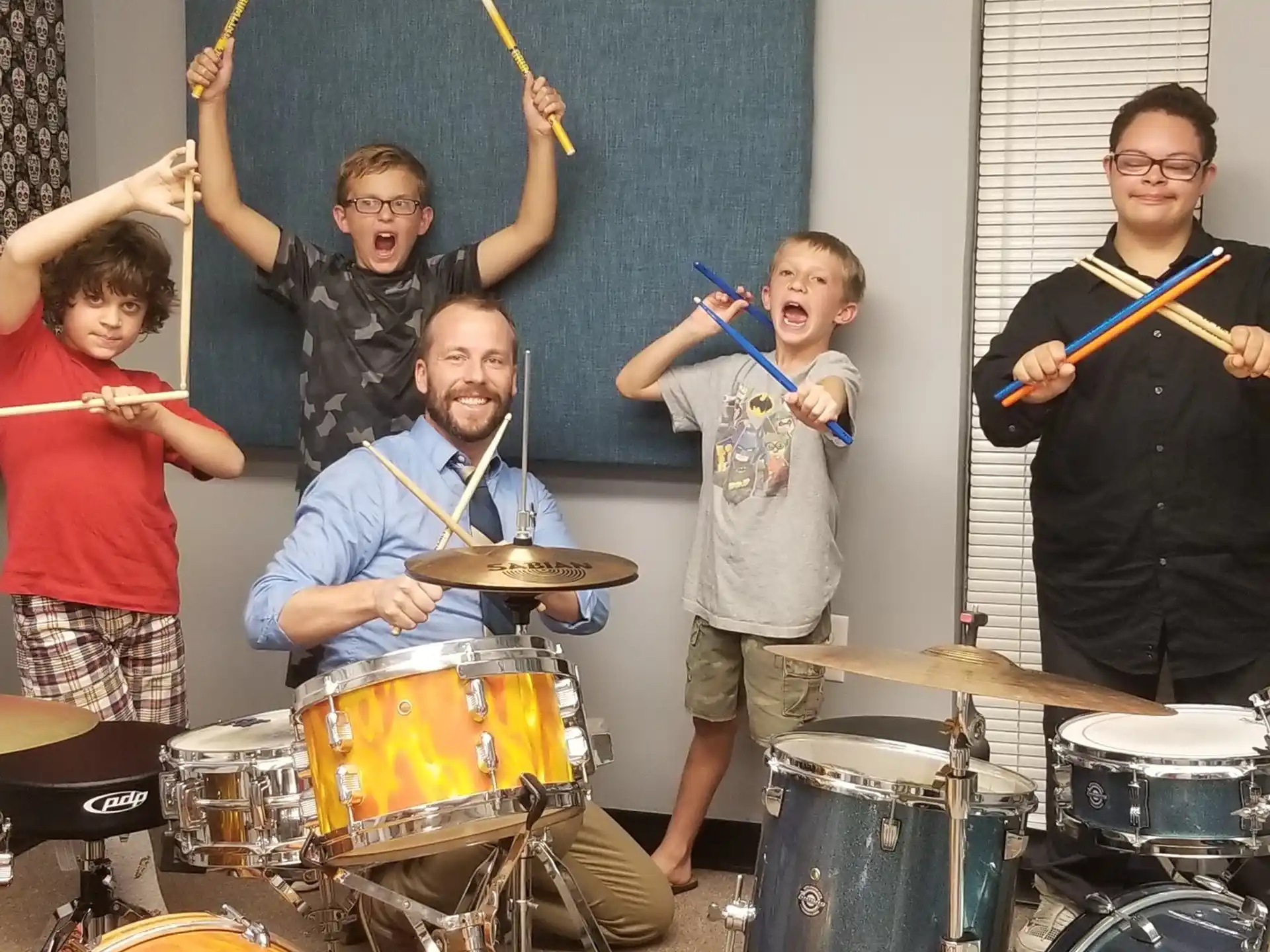 a group of people playing drums