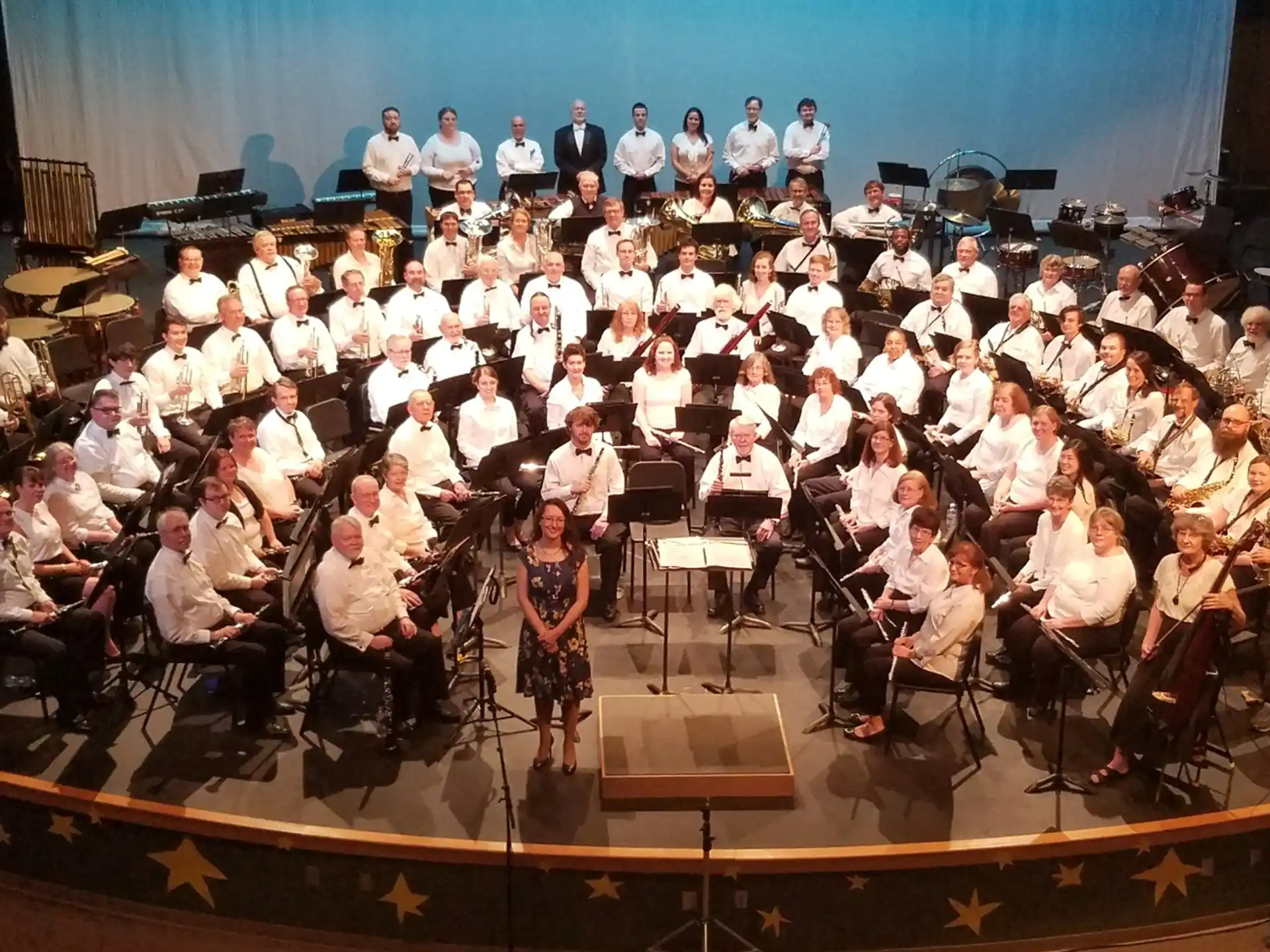 a group of people sitting on a stage