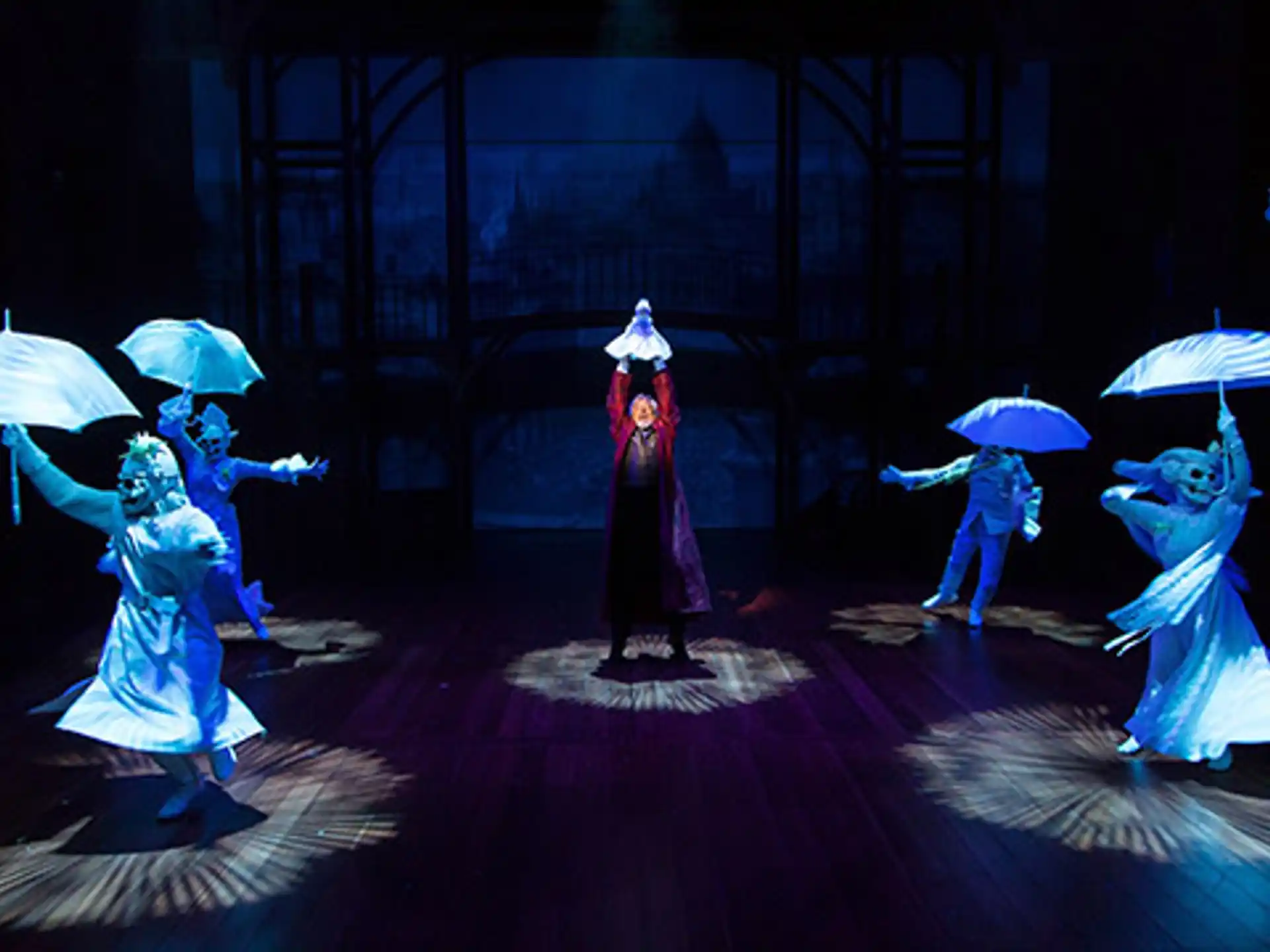 a group of people dancing with umbrellas