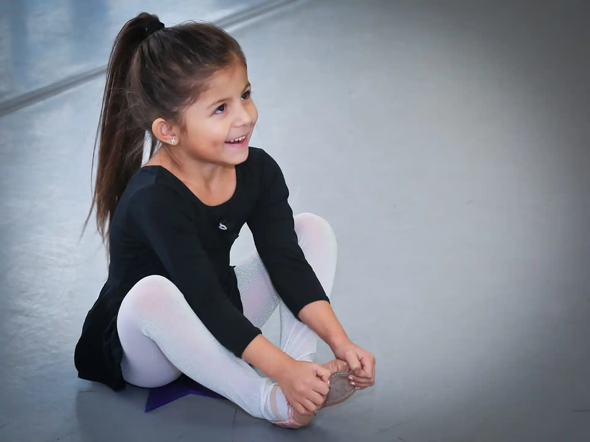 a girl sitting on the floor
