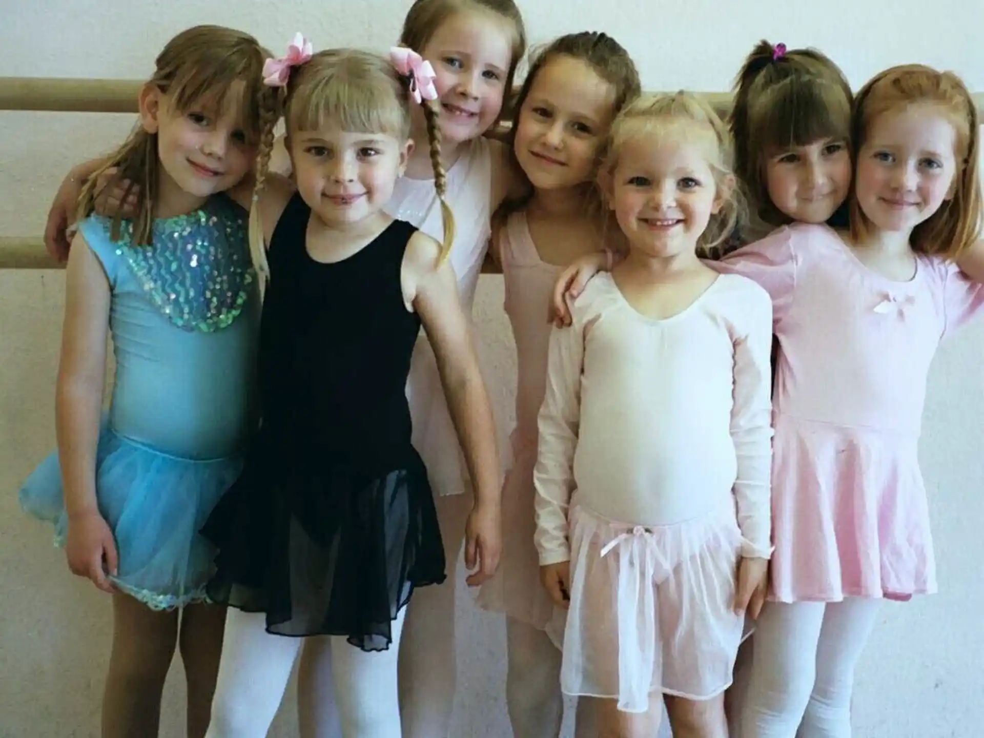 a group of girls posing for a photo