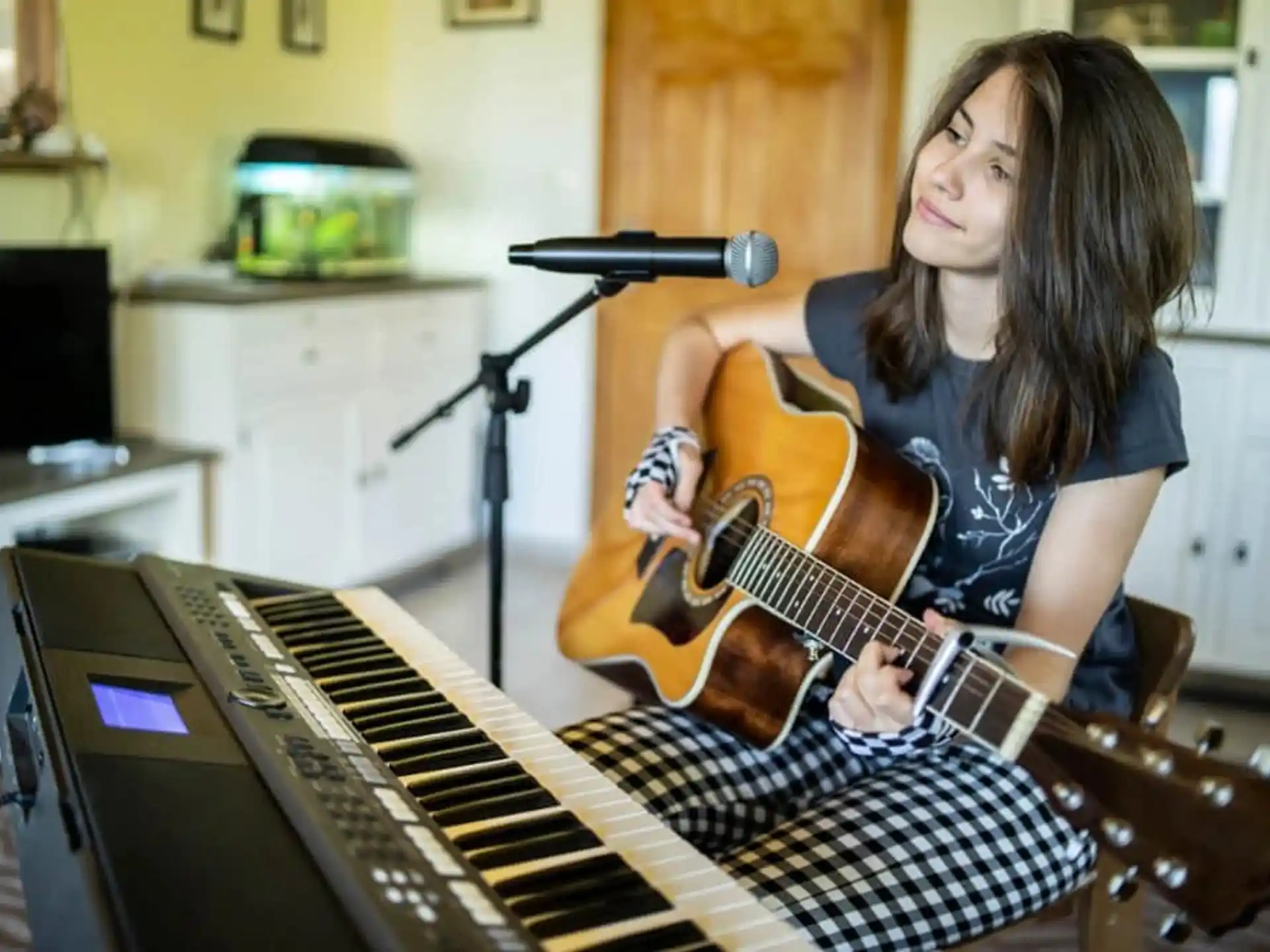 a woman playing a guitar