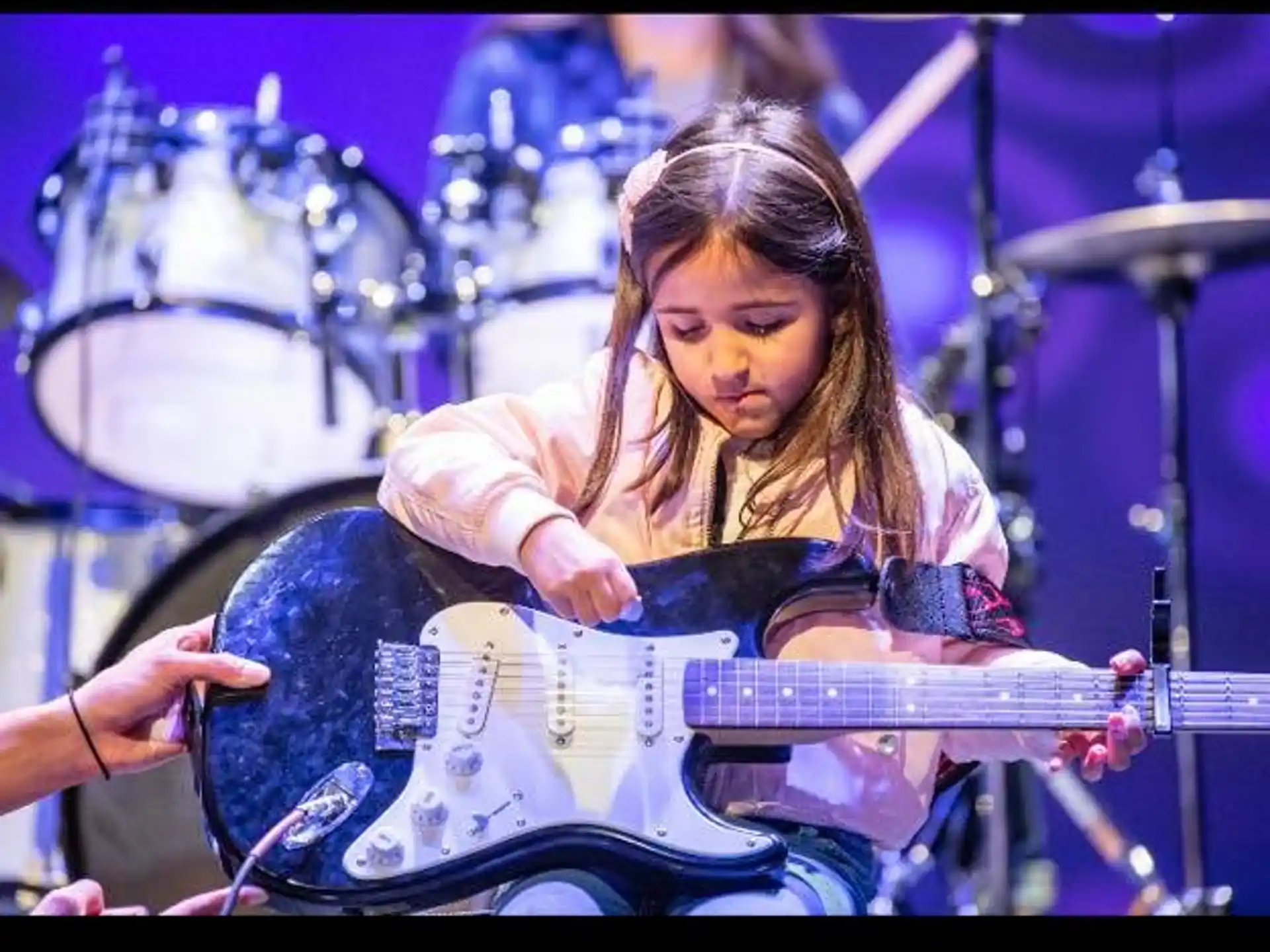 a person playing a guitar