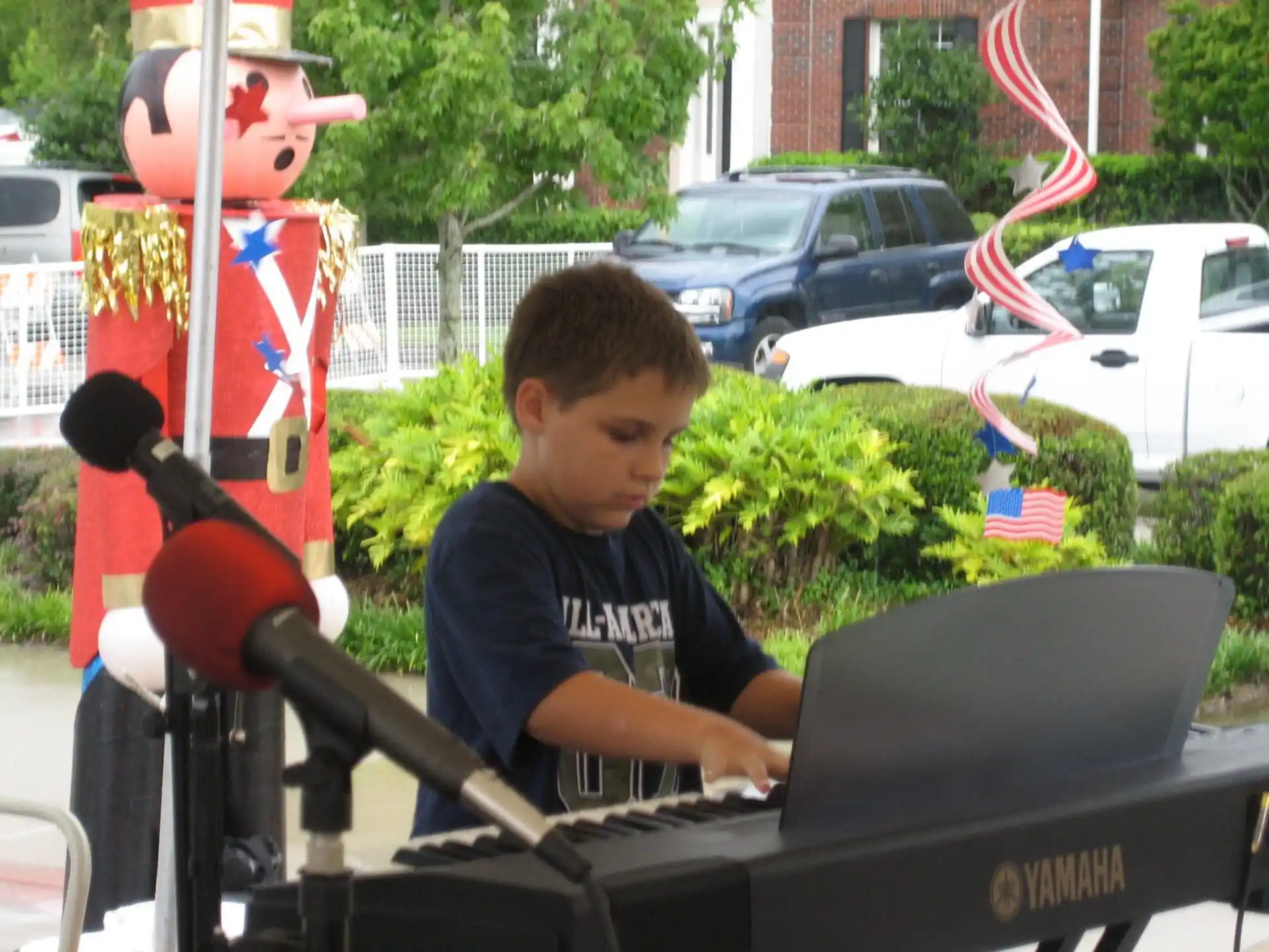 a boy playing a piano