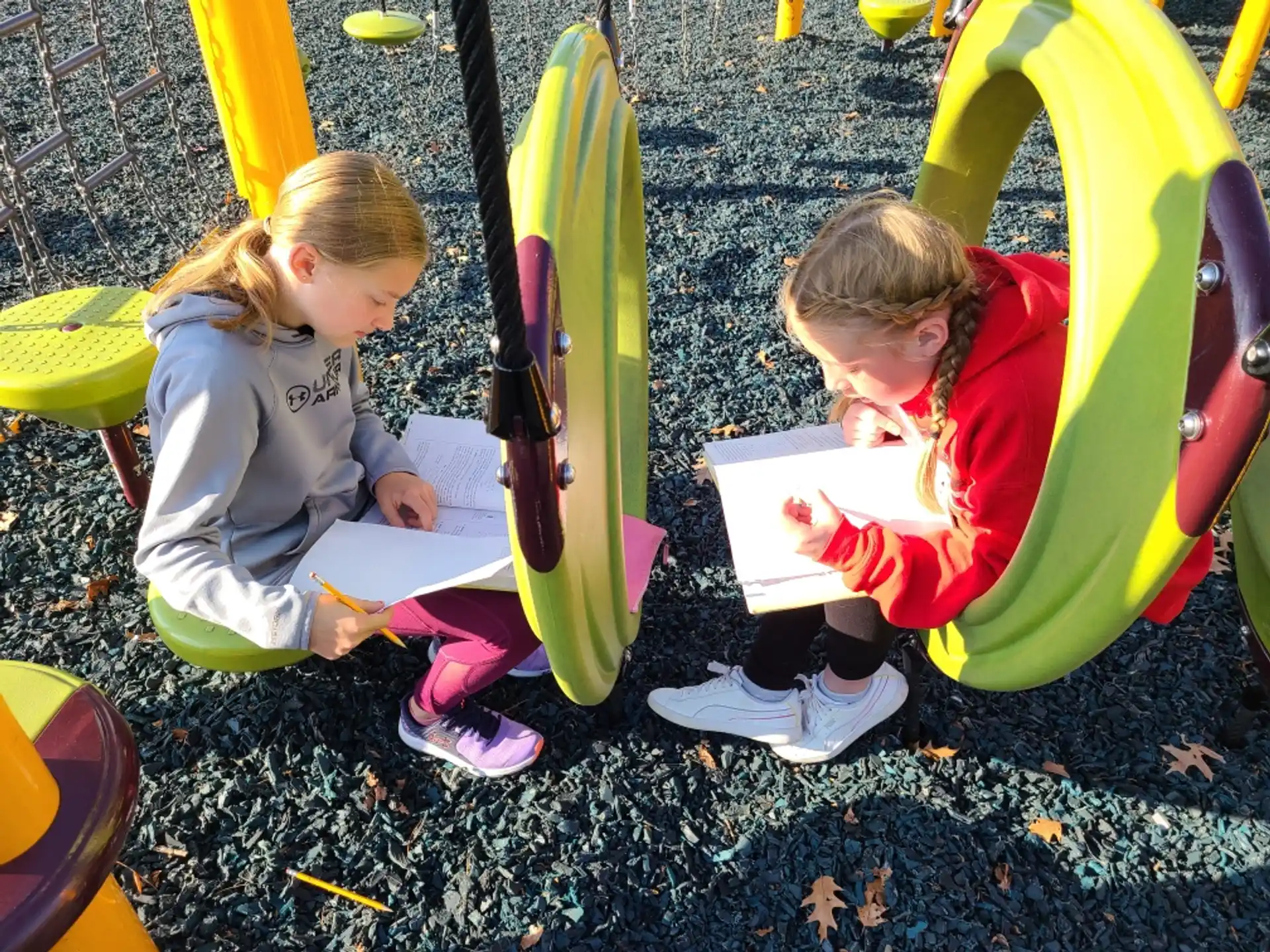 a few children sitting on the ground