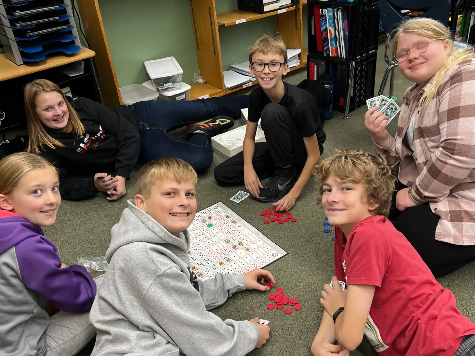 a group of children sitting on the floor