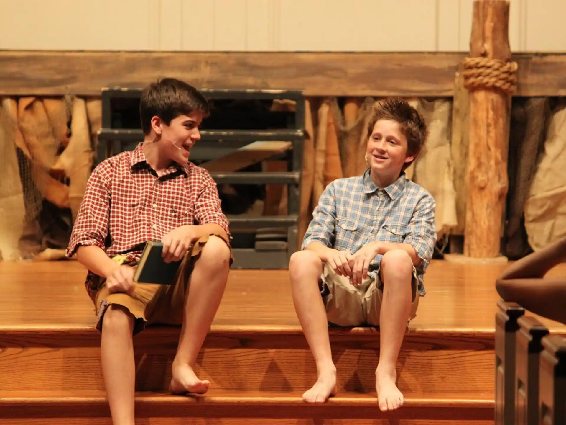 a couple of men sitting on a bench