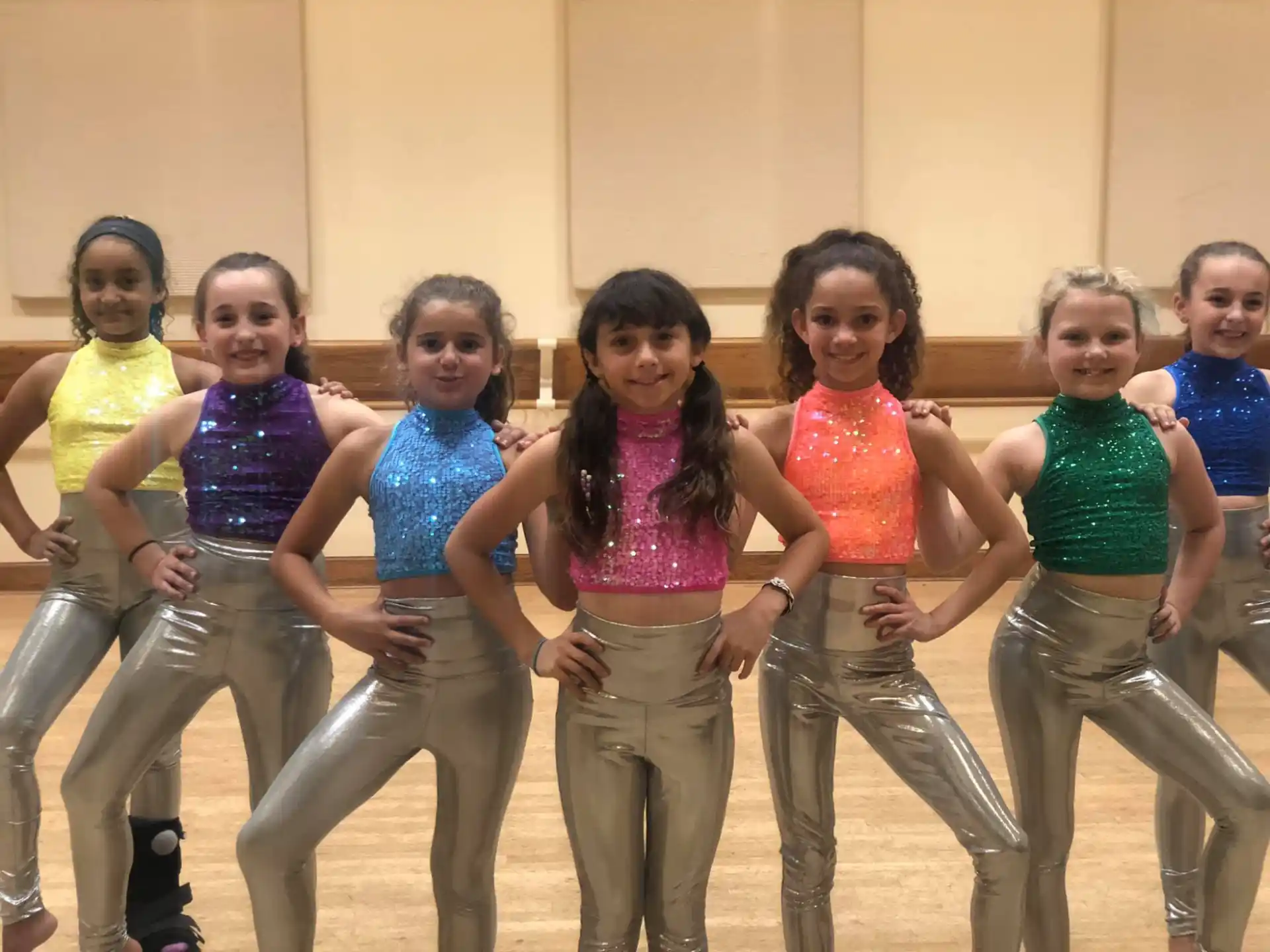 a group of girls wearing matching outfits