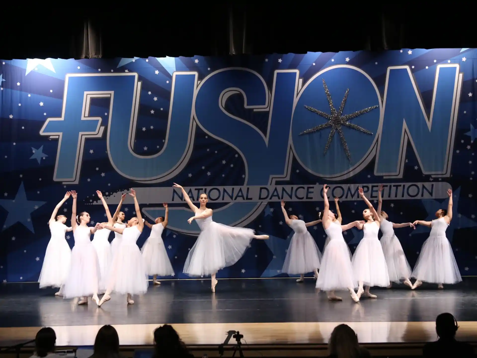 a group of women performing on stage