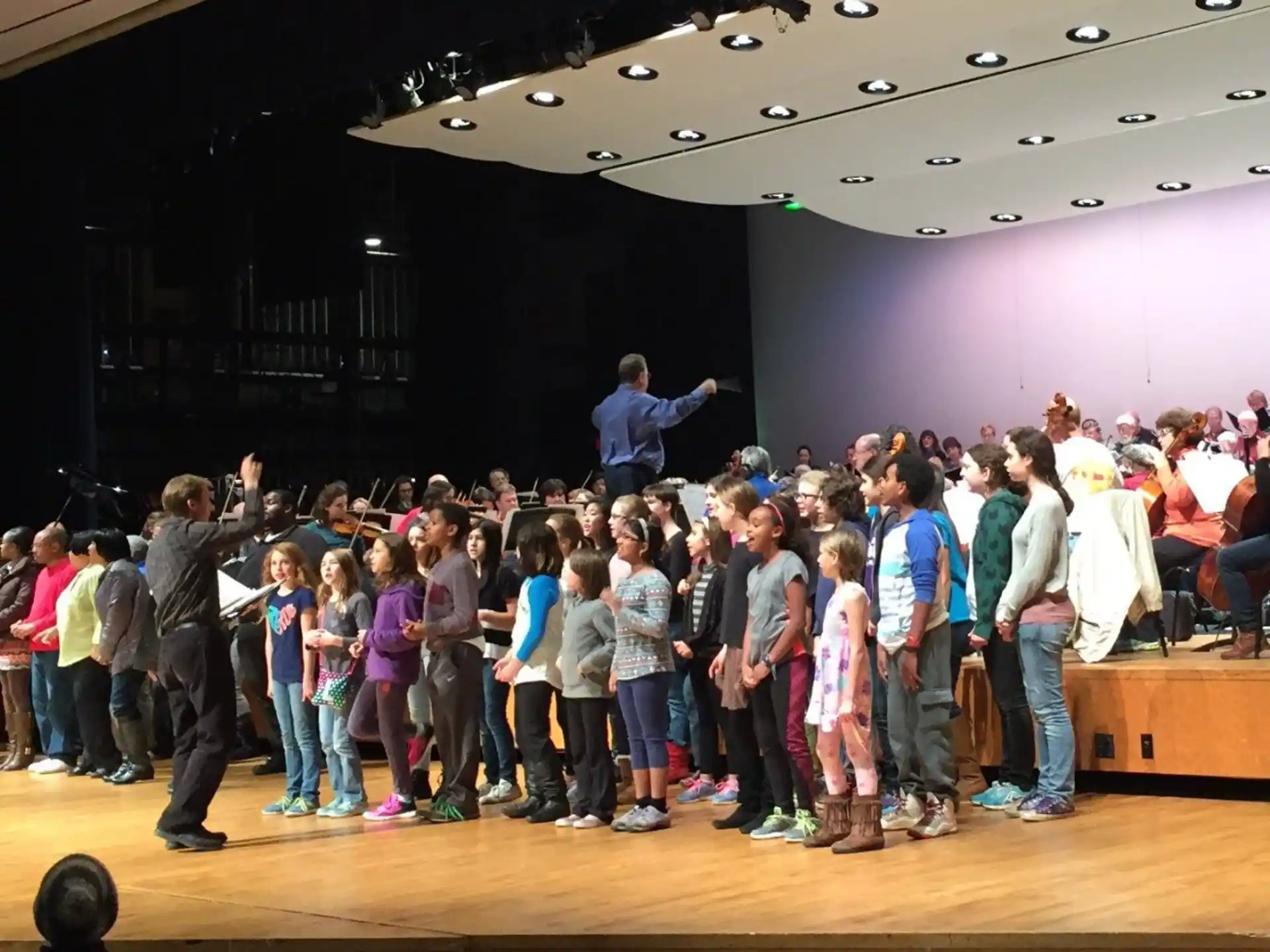 a group of people standing on a stage