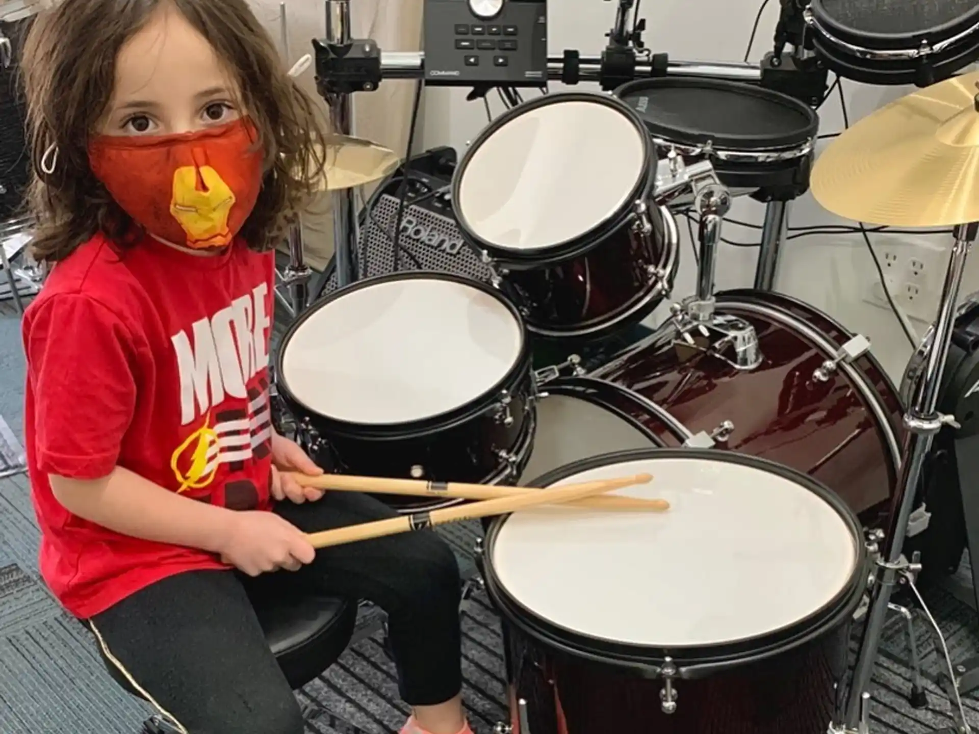 a girl playing the drums