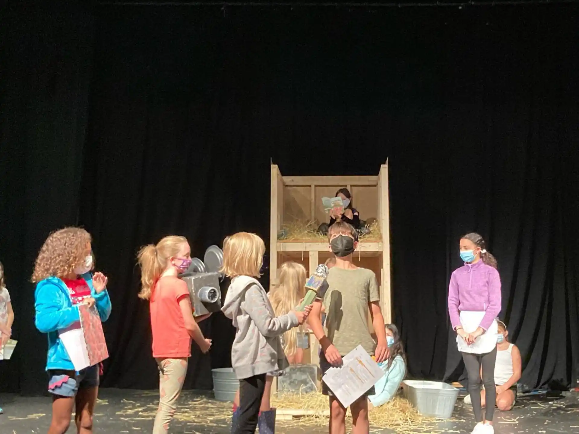a group of people standing in front of a stage