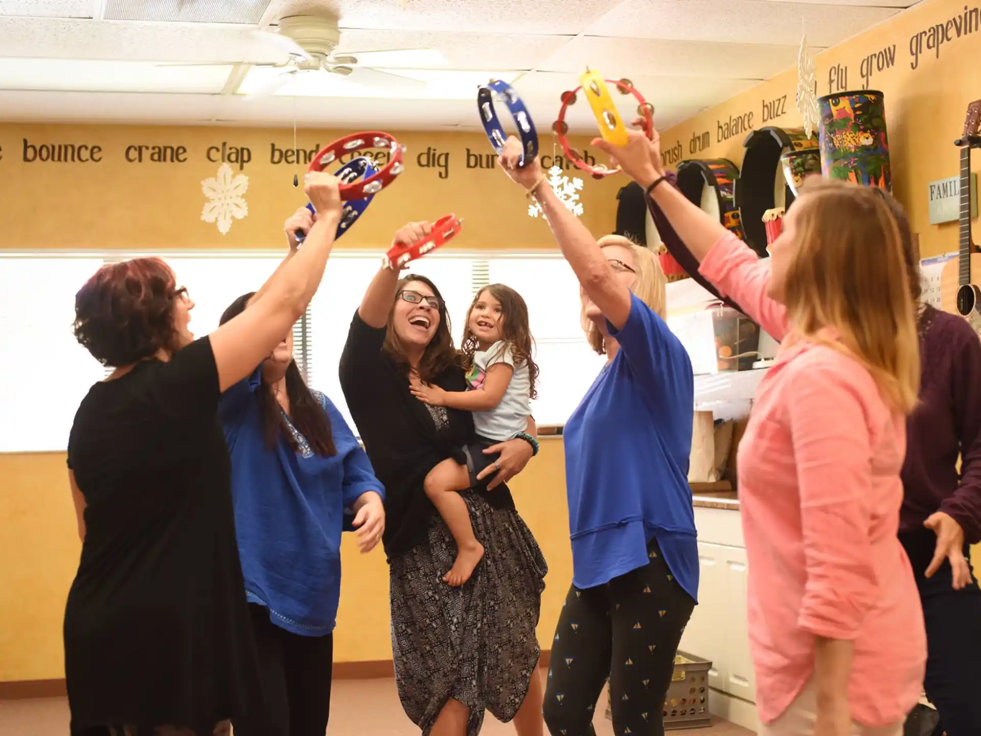 a group of people holding objects