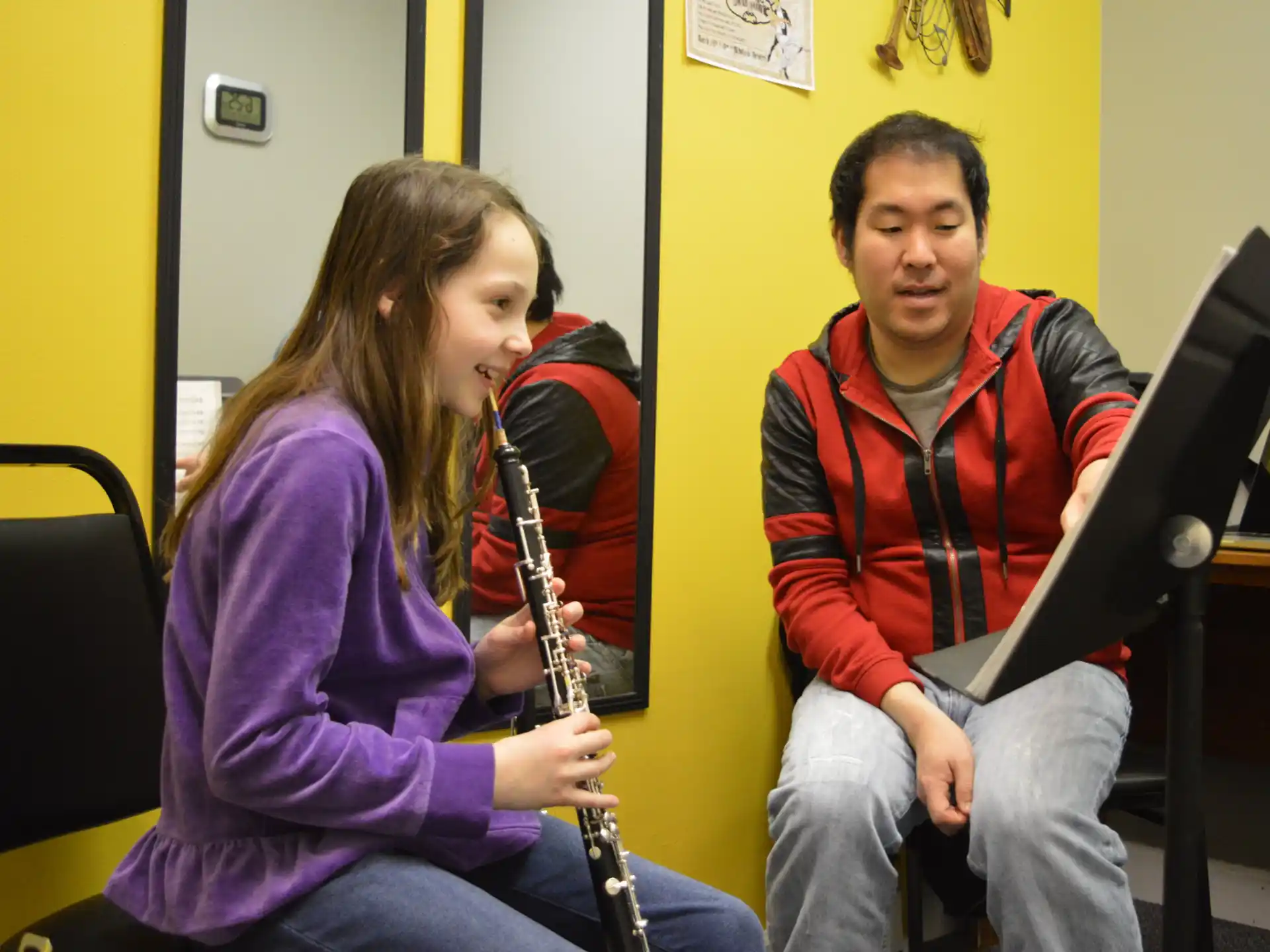 a man and a woman playing a saxophone