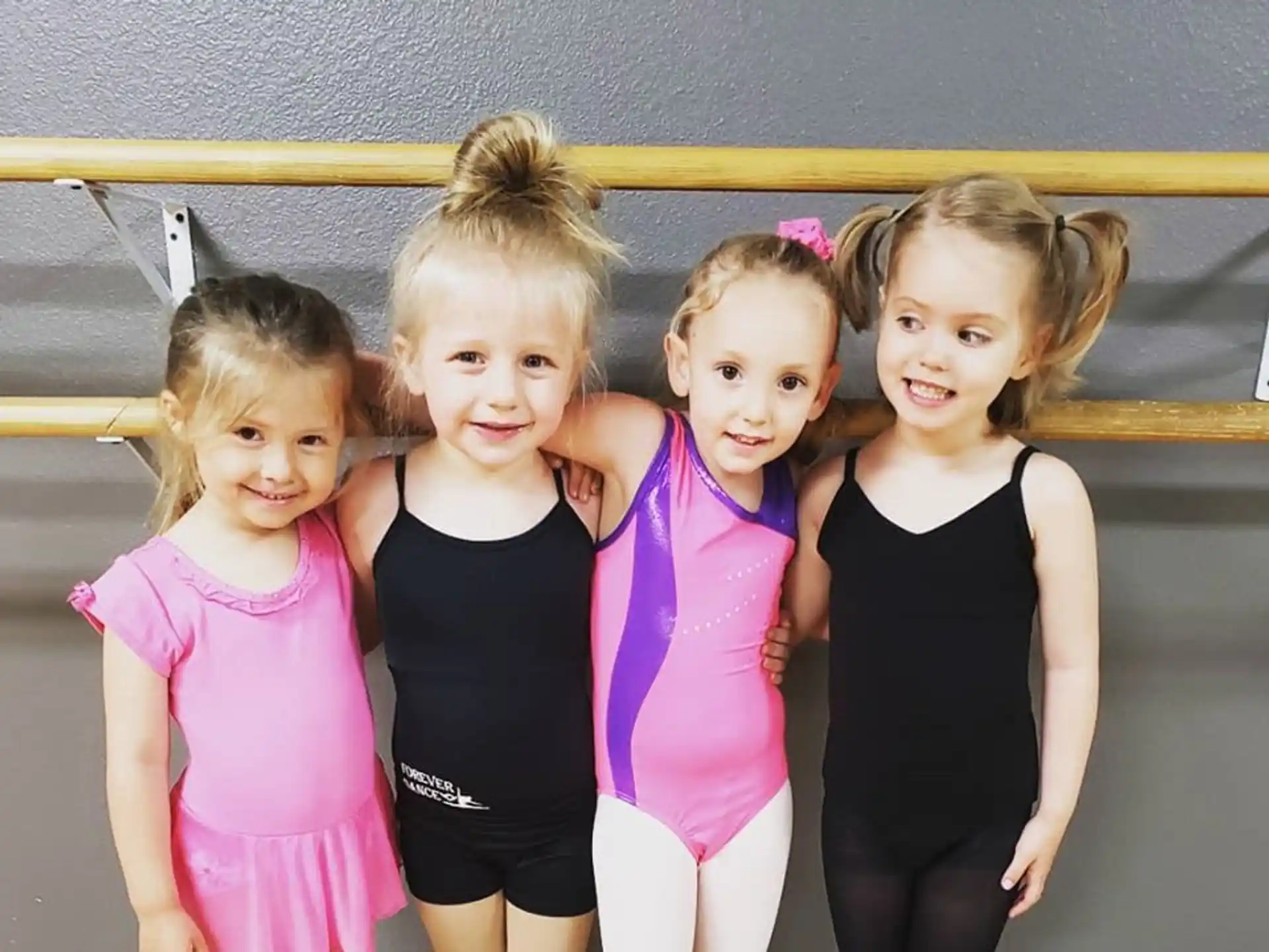a group of girls posing for a photo