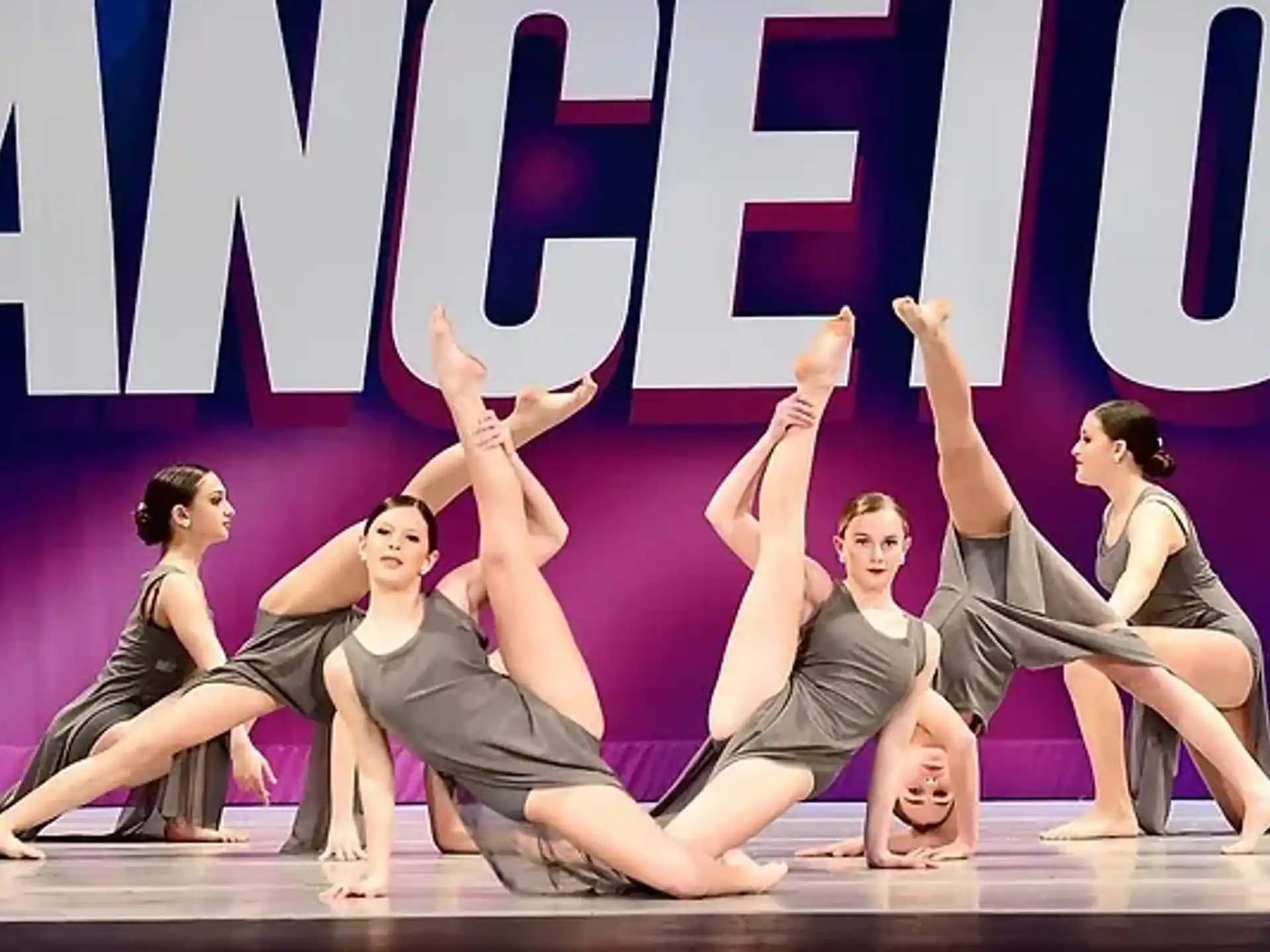 a group of women dancing on a stage