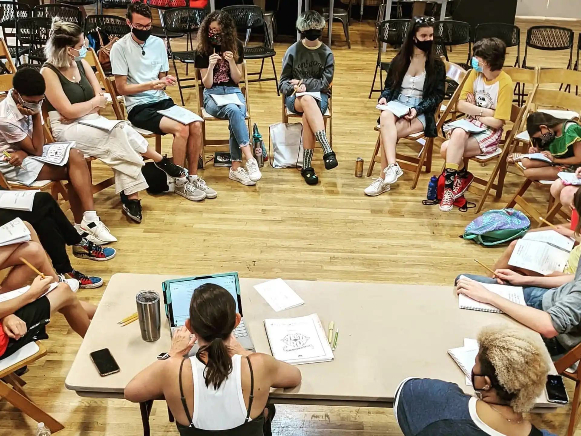 a group of people sitting in a circle