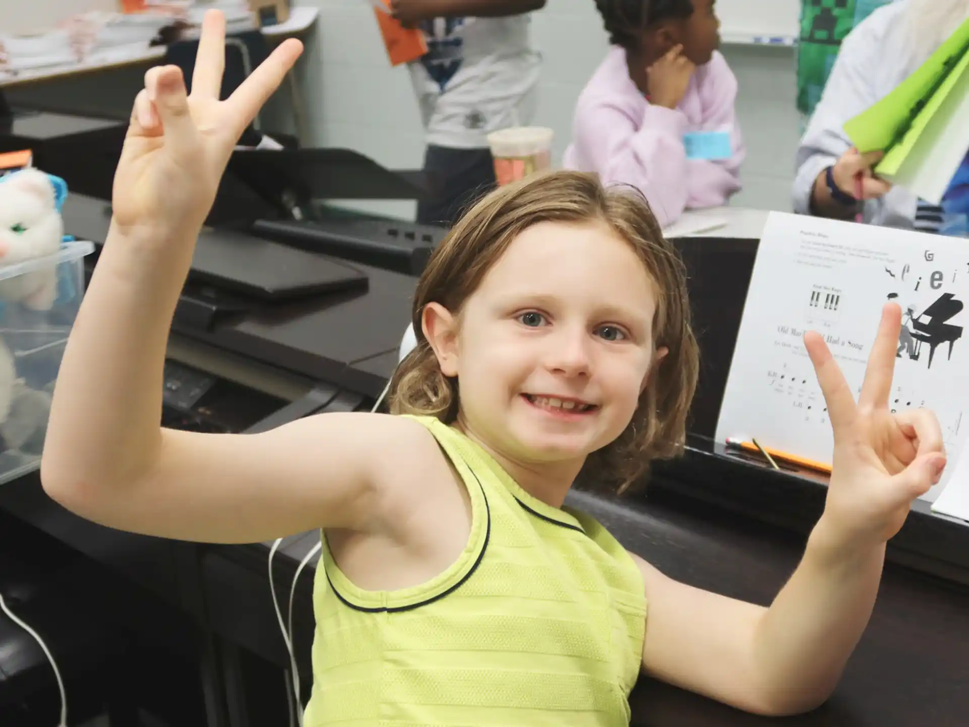 a girl holding up her hands