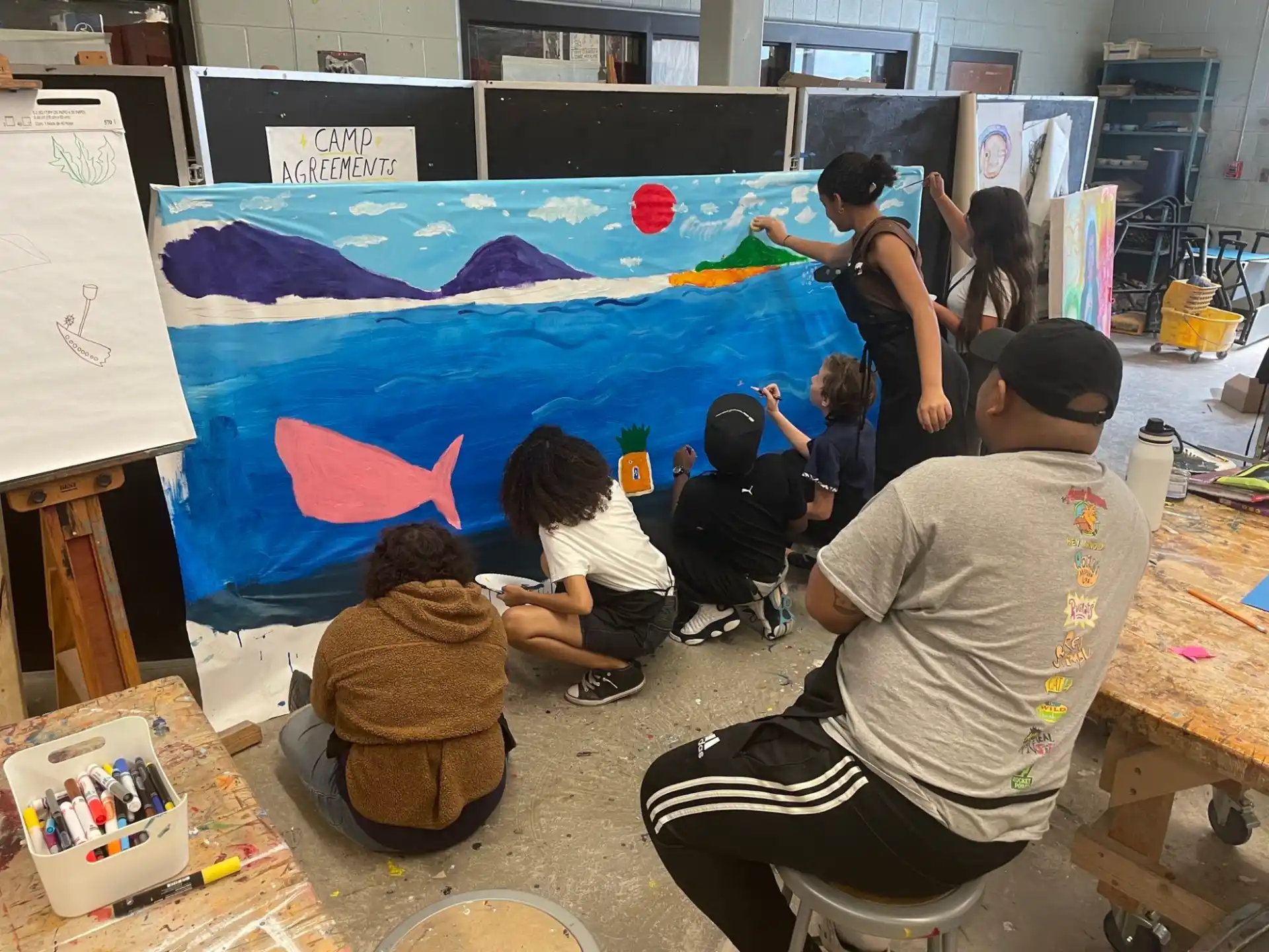 a group of people painting