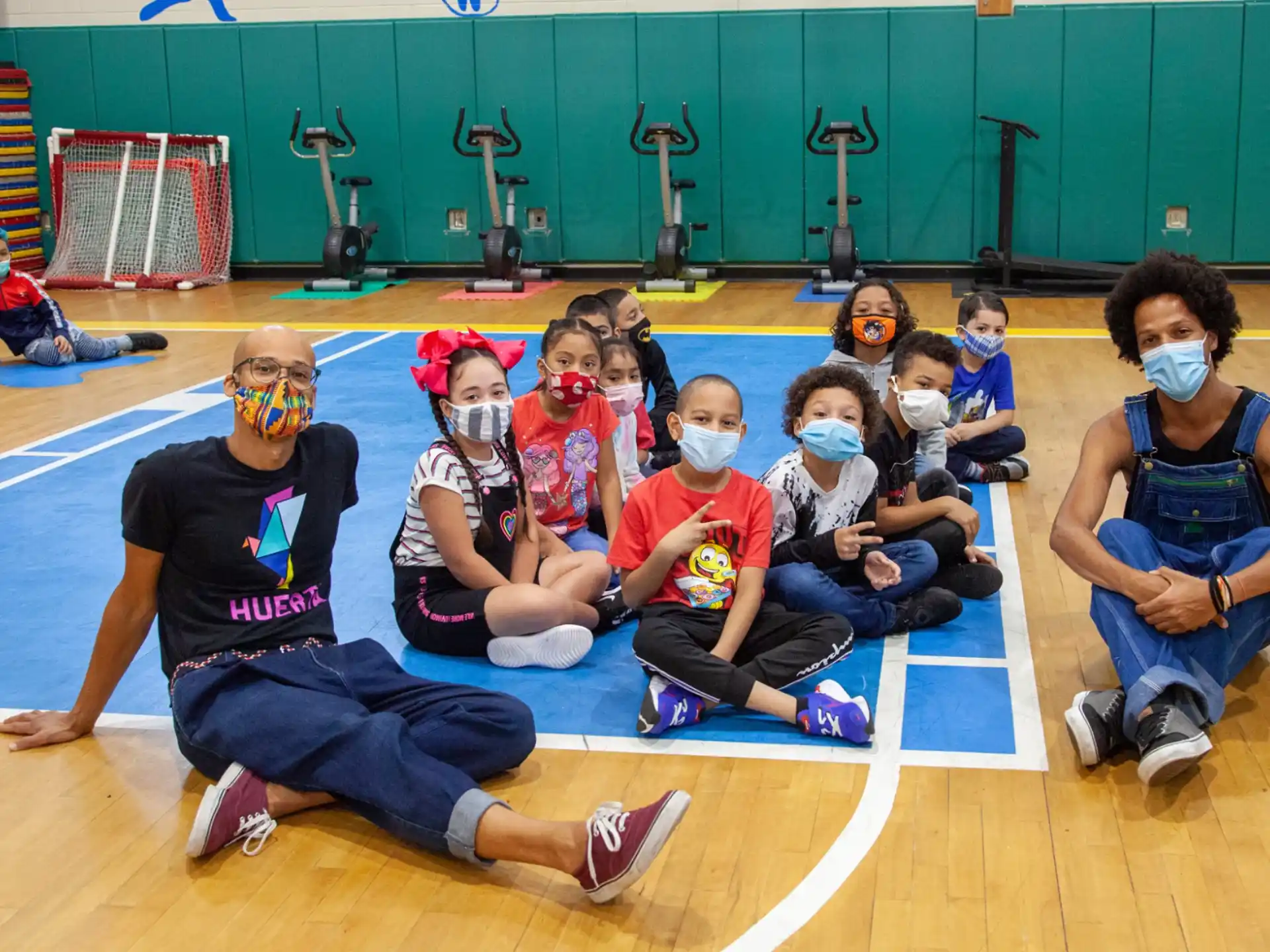 a group of people wearing masks