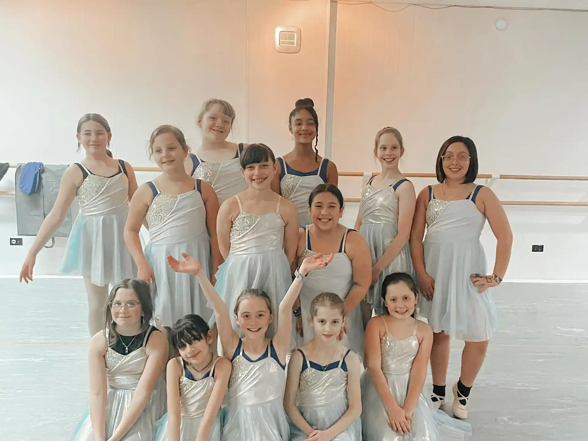 a group of women in white dresses