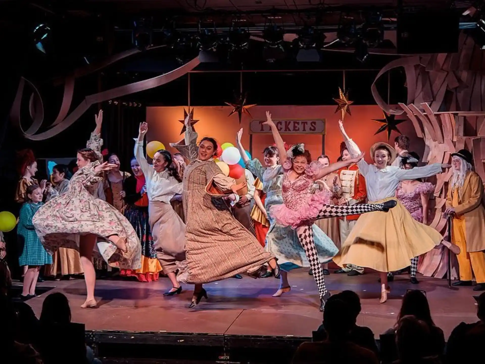 a group of people dancing on a stage